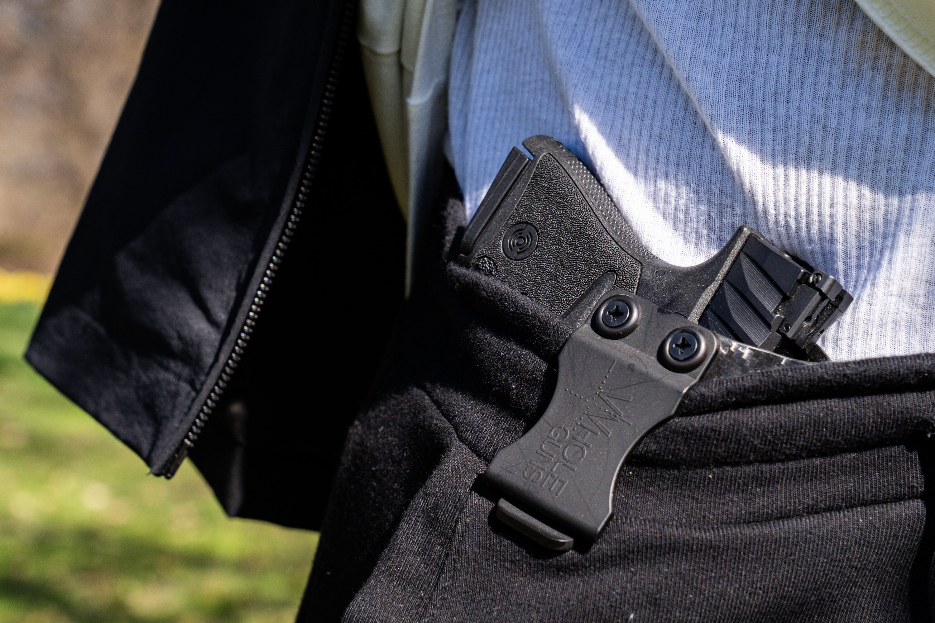 Wallace Lane carries his gun in a holster on Friday, March 29, 2024.