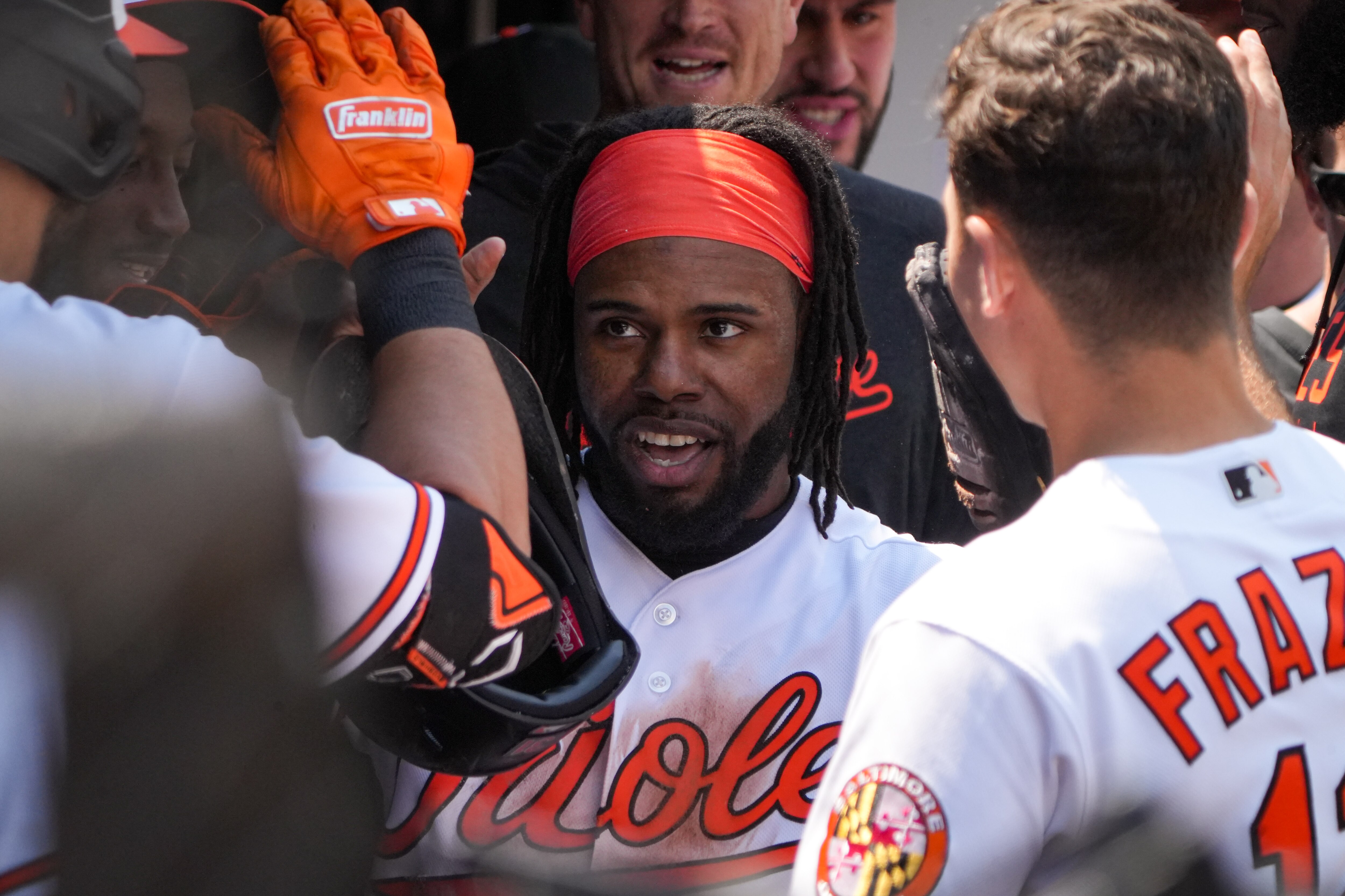 Baltimore Orioles center fielder Cedric Mullins (31) celebrates with teammates in the dugout after scoring in a baseball game against the Boston Red Sox at Camden Yards on Wednesday, April 26.