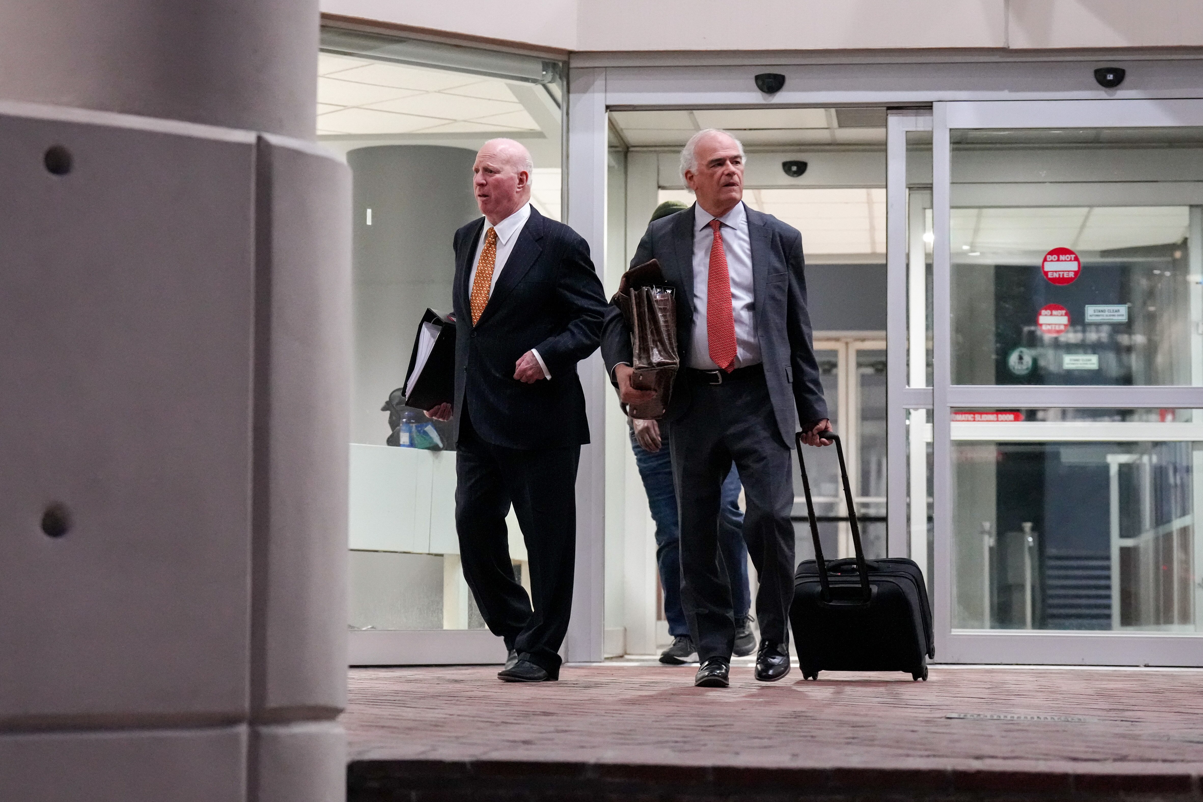 Attorney Stephen L. Snyder, left, leaves court with Gerald Ruter, his standby defense counsel, in Baltimore last month.