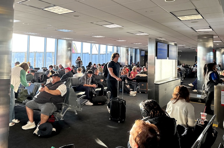 FRIDAY, MARCH 13, 2026 - Stranded travelers crowd the Southwest domestic terminal at Baltimore-Washington International Thurgood Marshall Airport on Friday after a ground stop due to a “strong chemical smell” at the region’s air traffic control facility, a Federal Aviation Administration spokesperson said in an email.