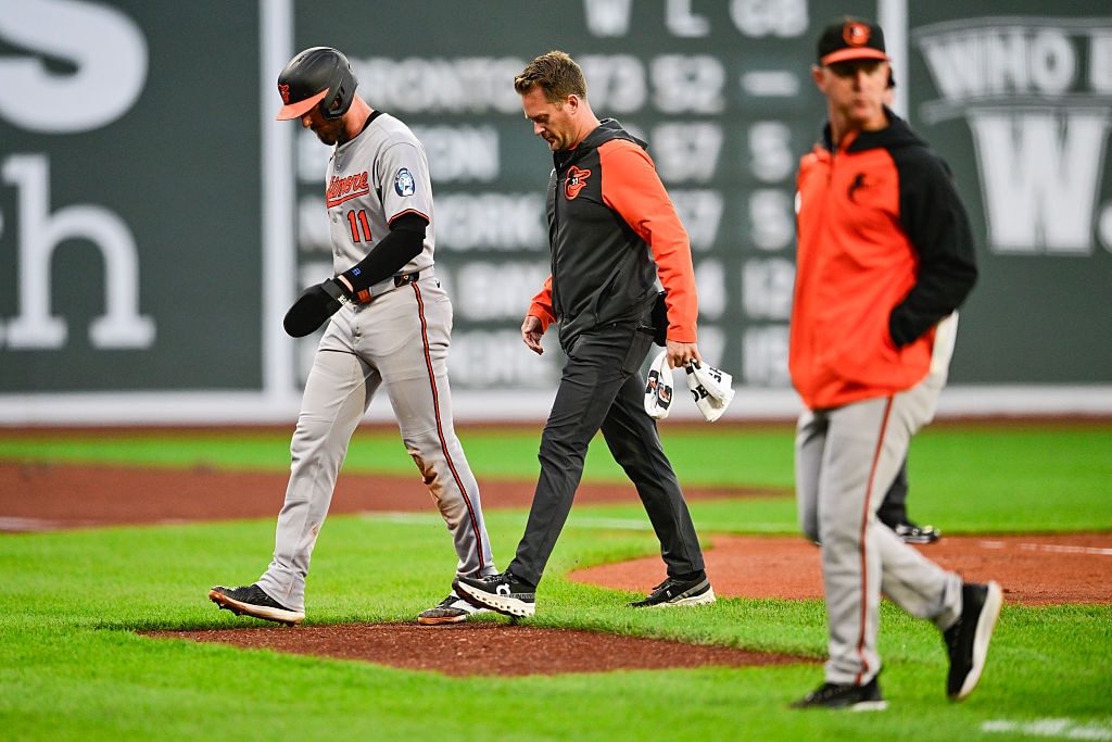 Jordan Westburg of the Baltimore Orioles walks off the field from second base due to an injury in the first inning.