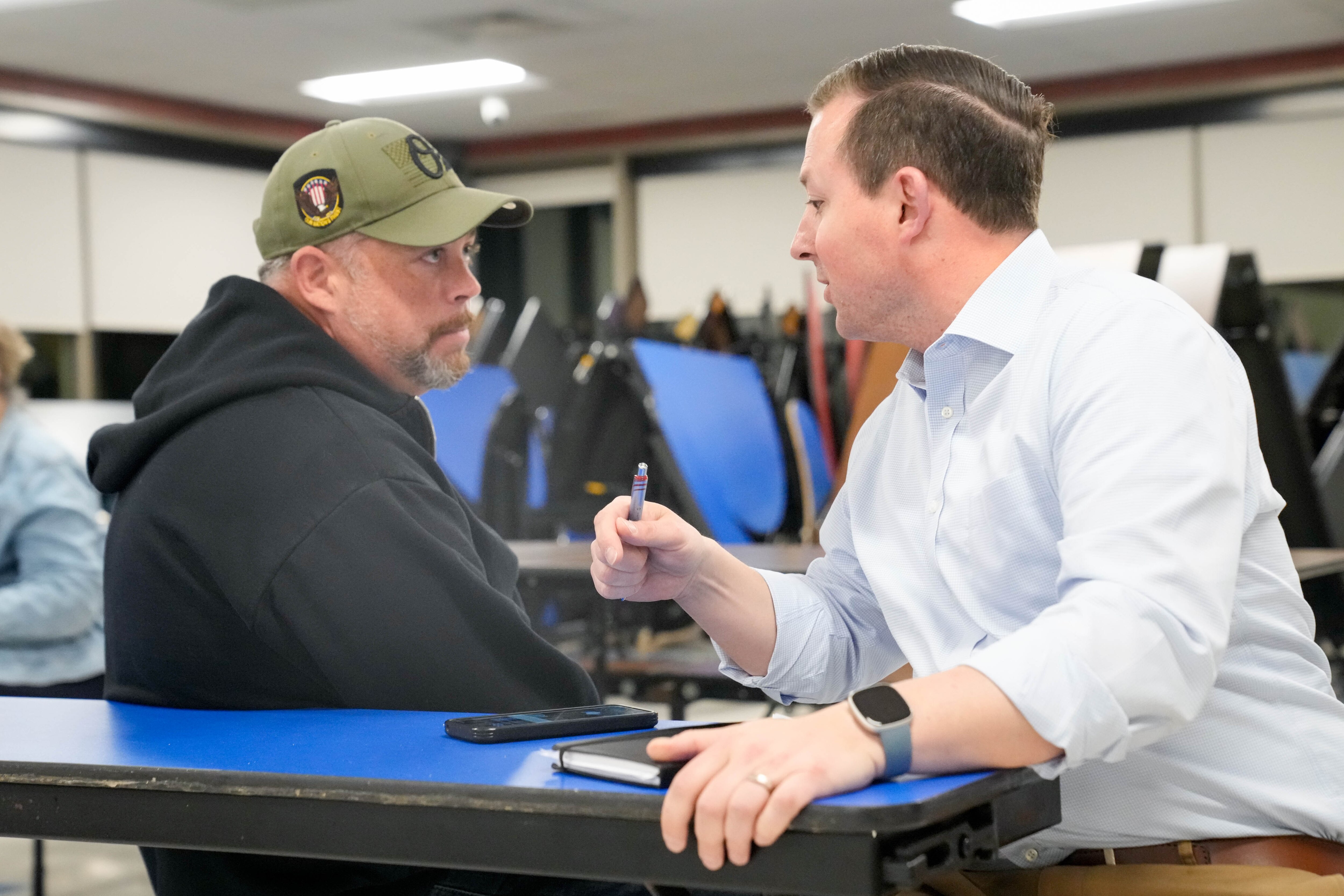 Bobby LaPin, left, speaks with Maryland Senate President Bill Ferguson following a District 46 candidate forum in Baltimore earlier this month.