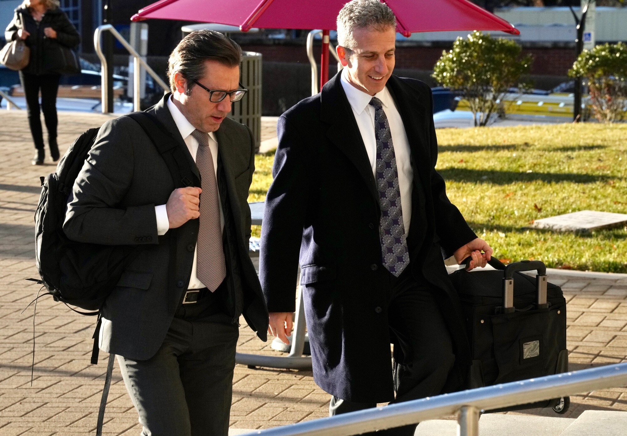 Louis Angelos, left, enters the Baltimore County Courts Building with his attorney, Jeffrey Nusinov, on January 26, 2023.