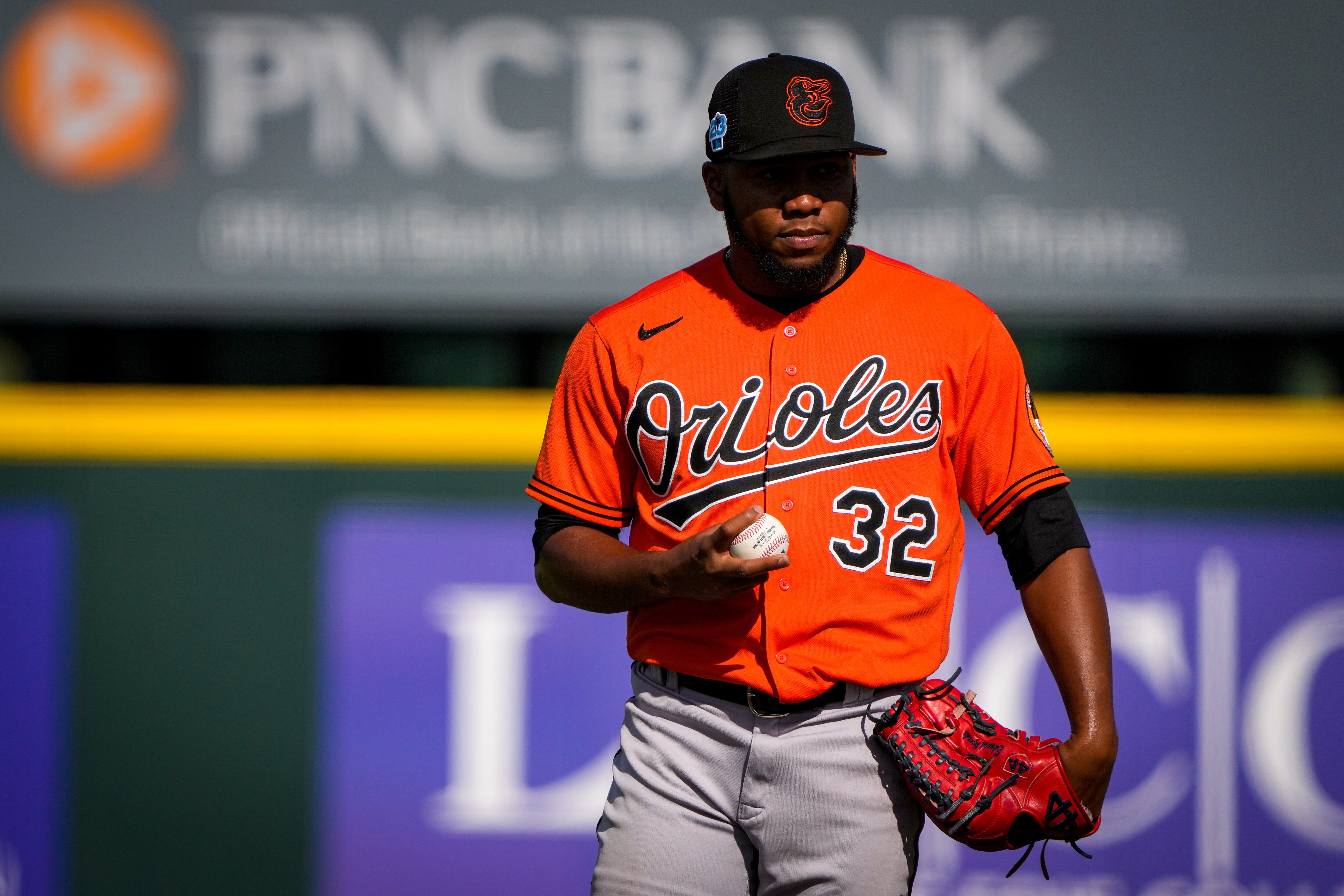 Eduard Bazardo (32) prepares to deliver a pitch after giving up a score at LECOM Park during the seventh inning of a game against the Pittsburgh Pirates on 2/28/23. The Baltimore Orioles traveled to Bradenton on Tuesday as part of the Florida Grapefruit League during their spring training session.
