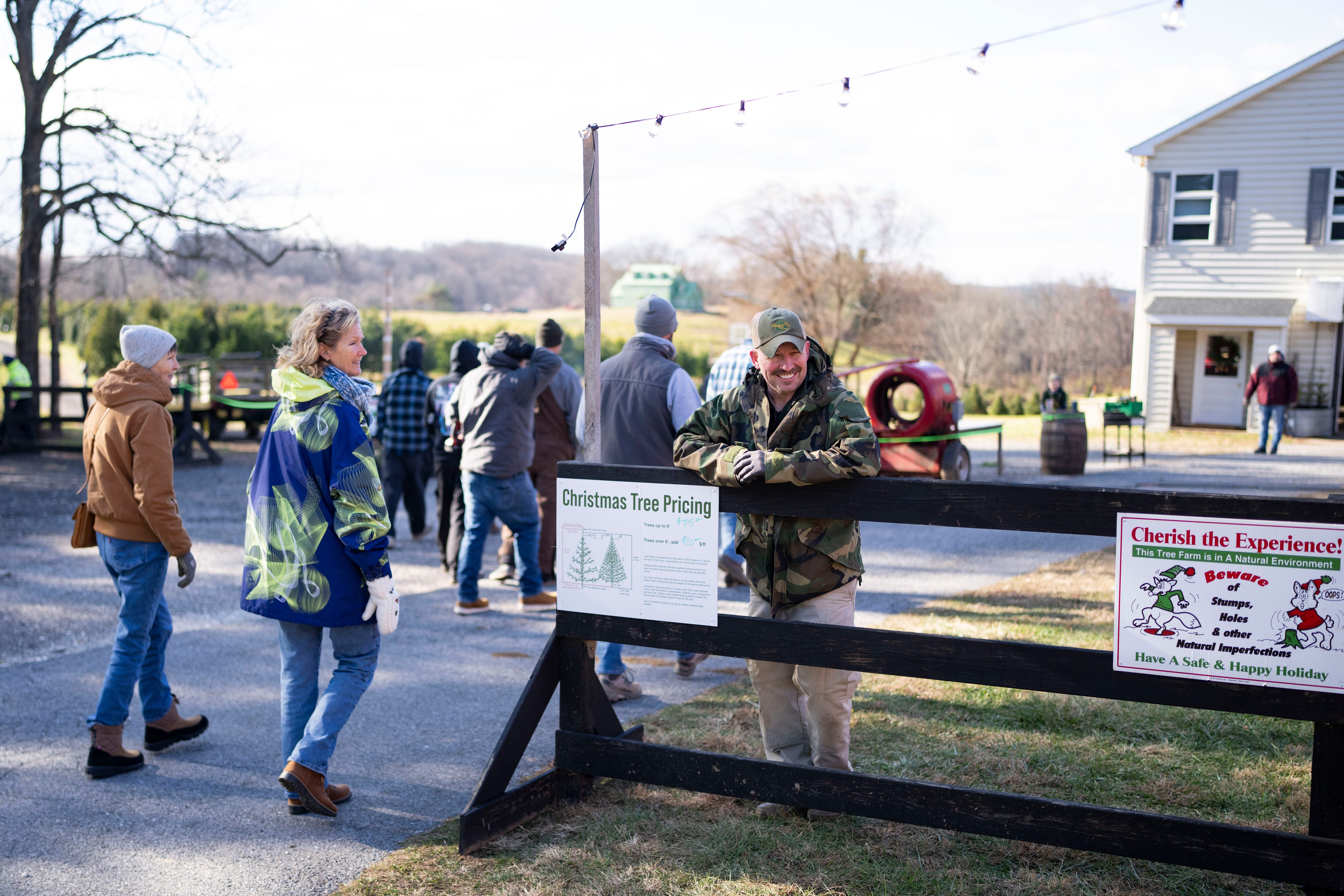 Stefan Nock owner of Prettyboy Run Farms greets guests on their way to cut down their tree in Parkton, Friday, November 28, 2025.
