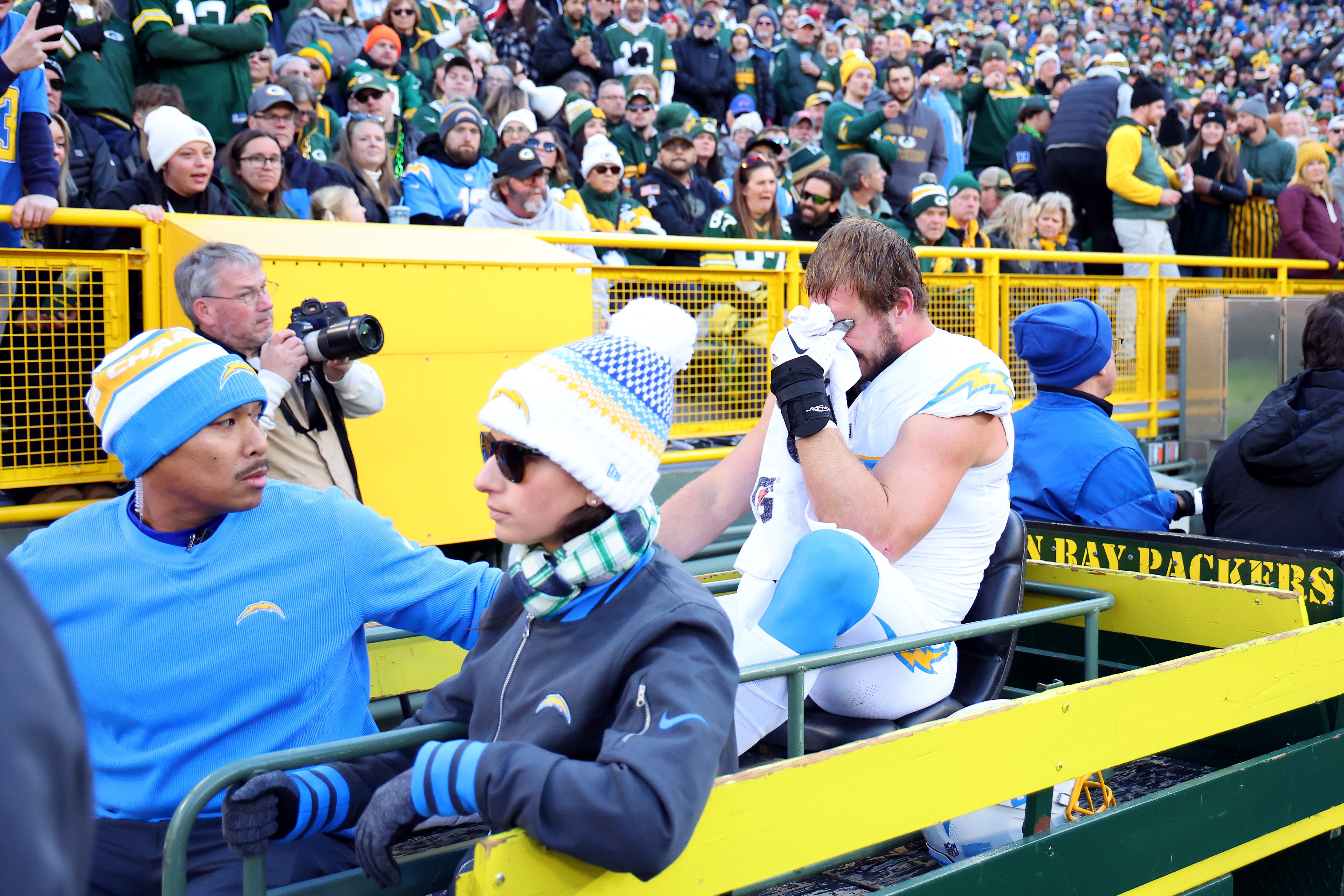Chargers pass rusher Joey Bosa leaves the field on a cart Sunday during the first quarter against the Packers.