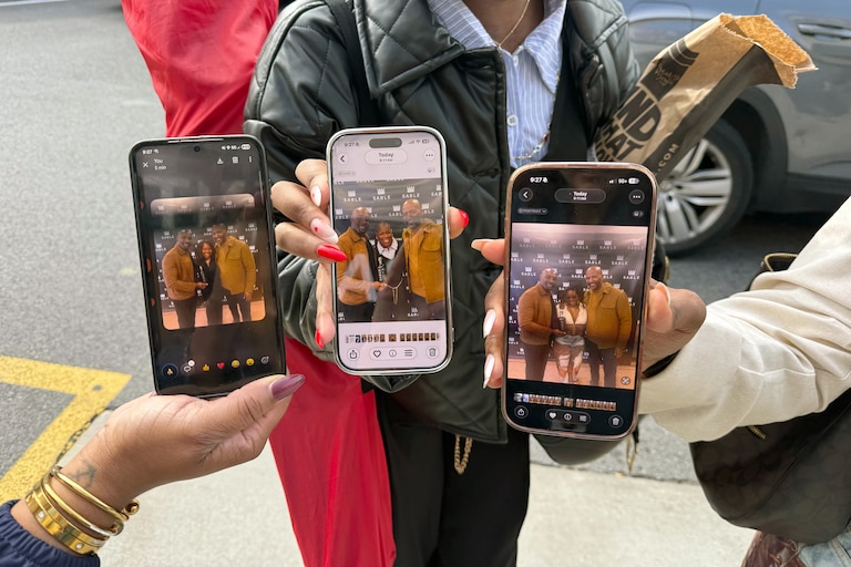 SATURDAY, MAY 2, 2026 - From left, Piney Johnson, Maya Ruffin and Janae Brown hold up their photos with Morris Chestnut and Malcom D. Lee at Total Wine and More in Towson.