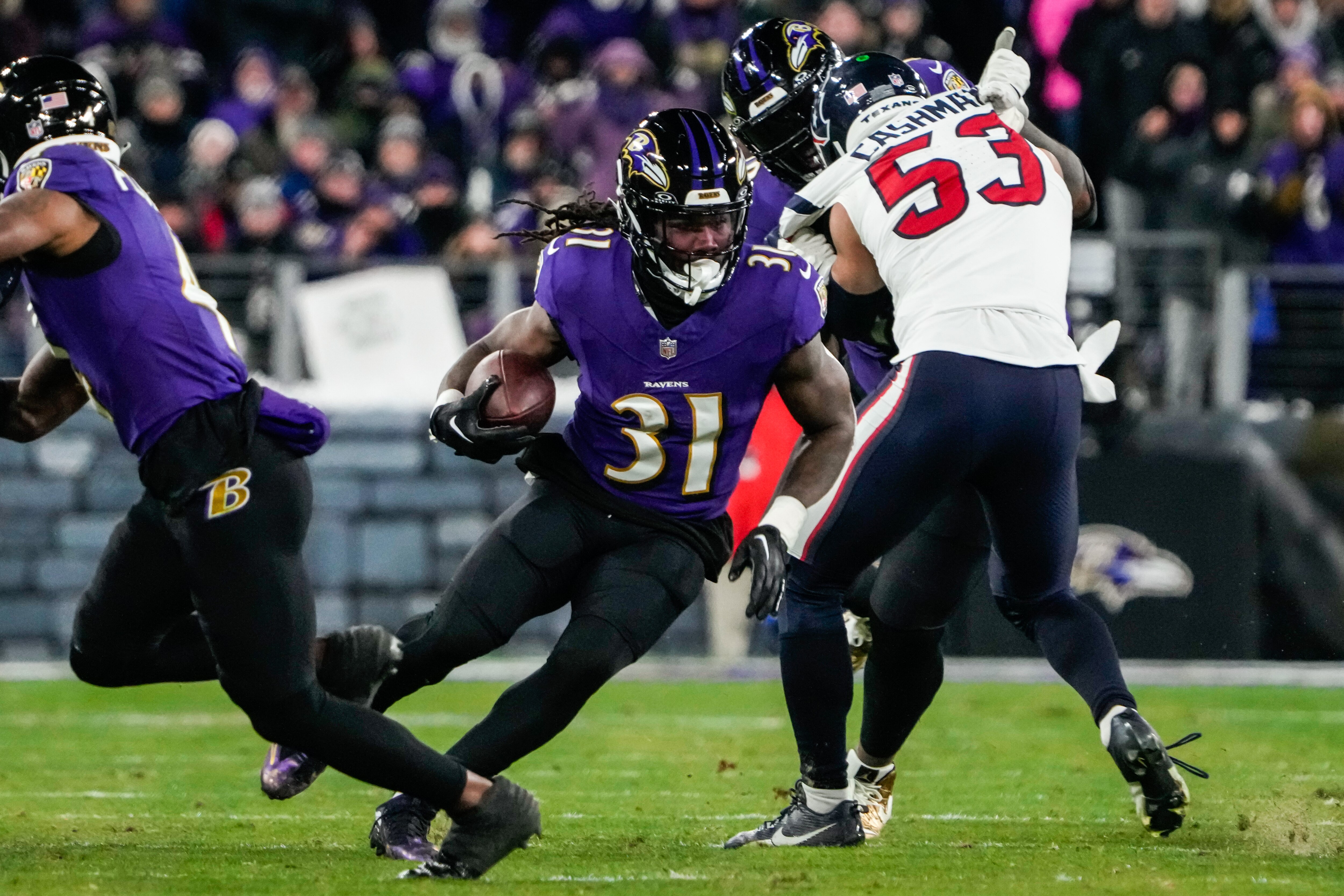 Baltimore Ravens running back Dalvin Cook (31) runs down the field during the fourth quarter against the Houston Texans at M&T Bank Stadium on Saturday, Jan. 20, 2024.