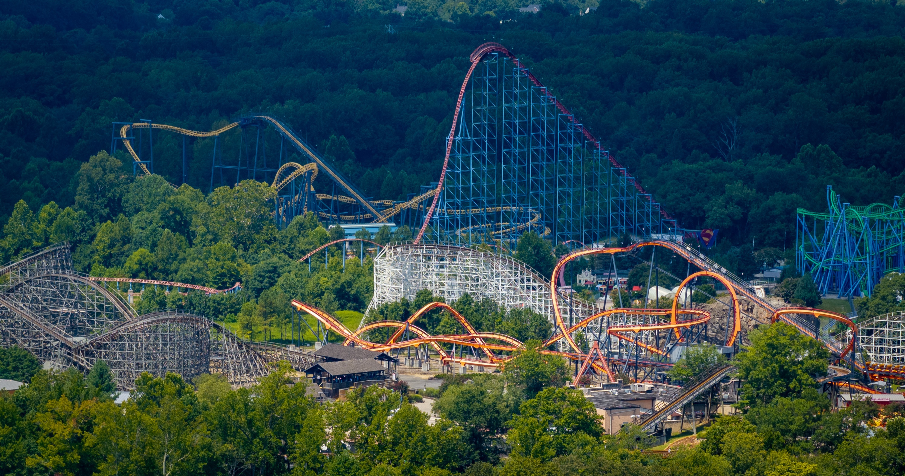 Friday, Aug. 15, 2025 — The roller coasters of Six Flags America are seen above the tree line near Bowie.