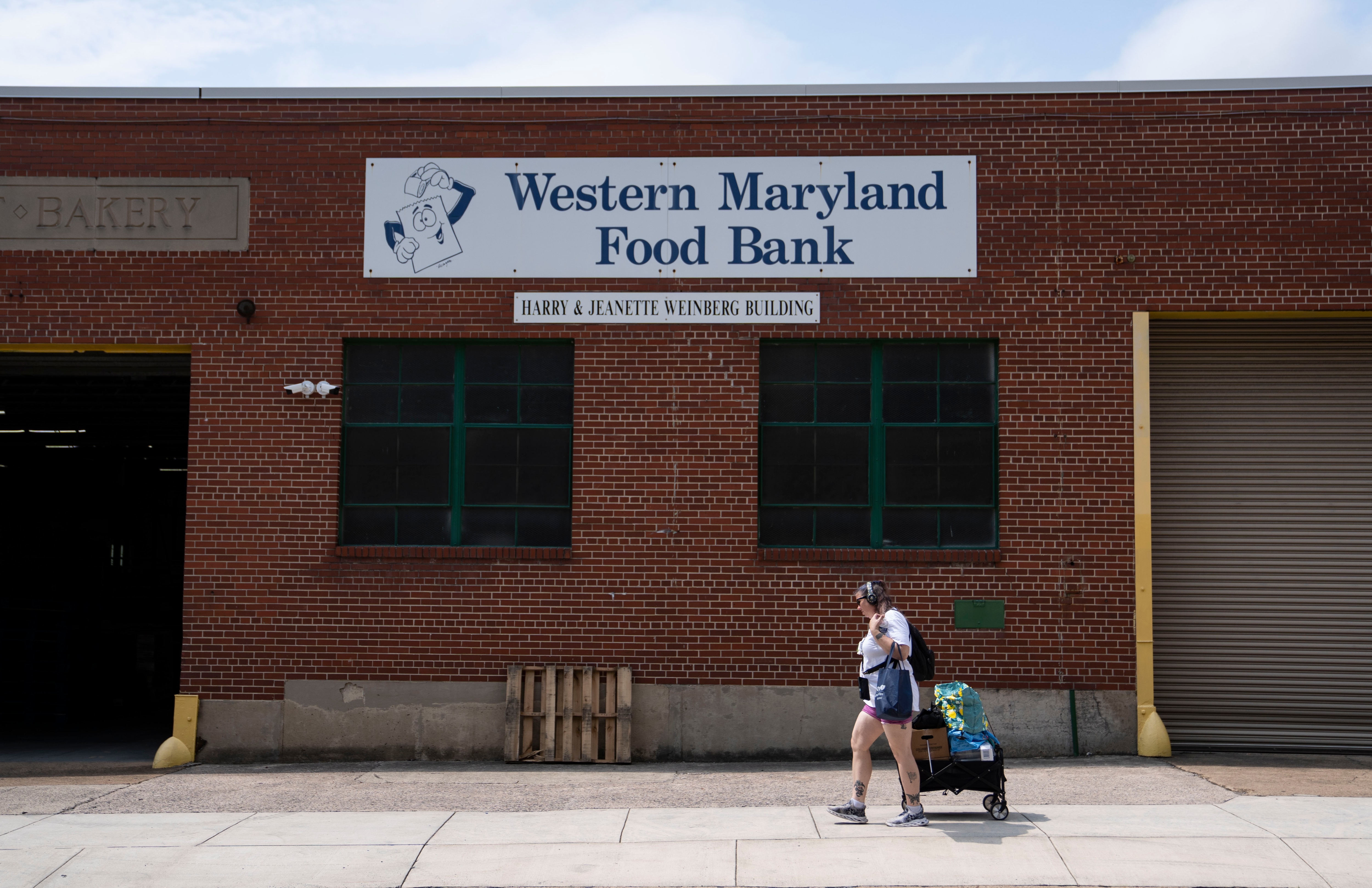Mandy Gordon of Cumberland pulls her wagon full of food she received from Western Maryland Food Bank.