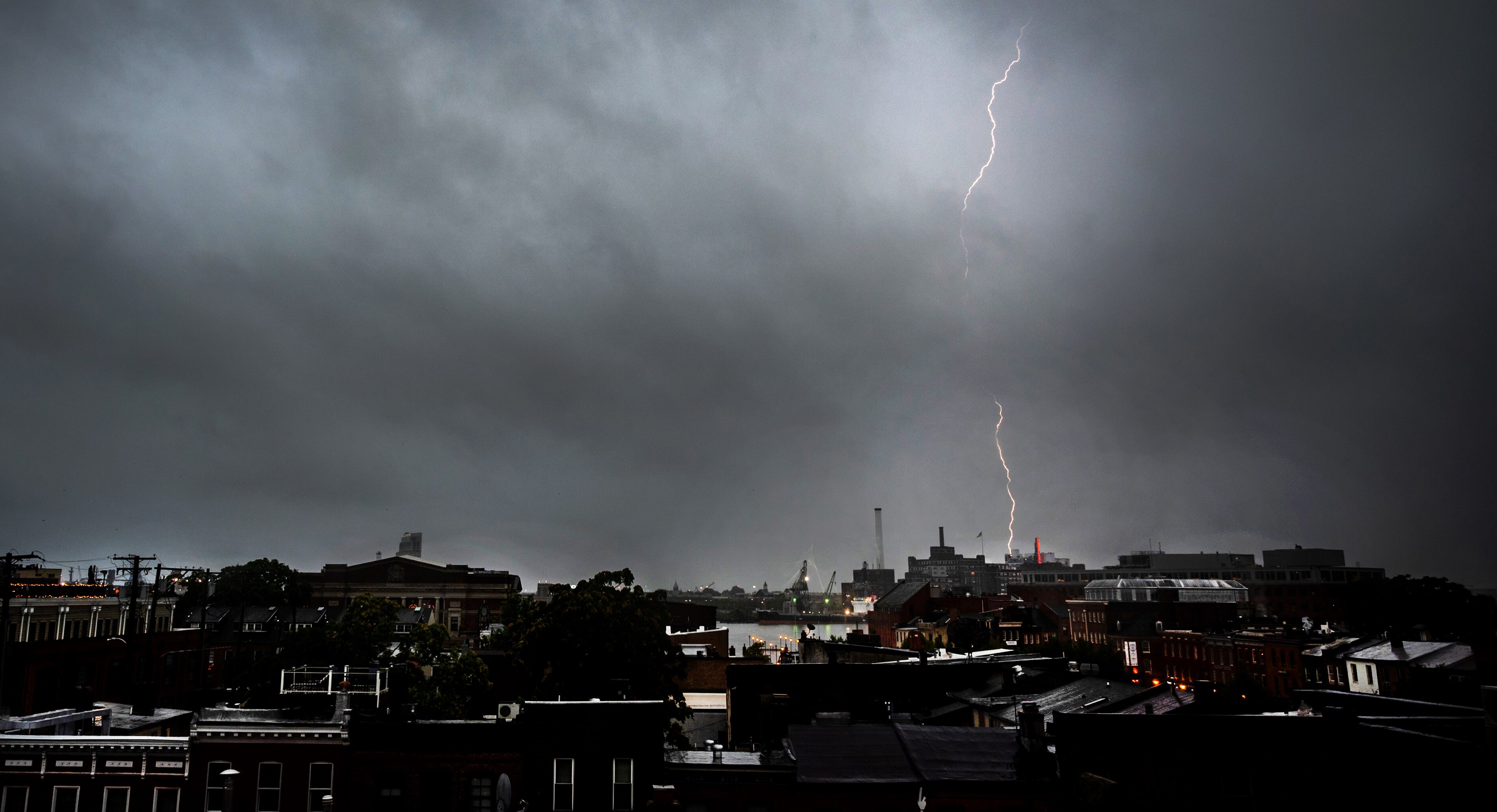 Lightning strikes during a thunderstorm in Baltimore, Maryland, on Monday, Aug. 7, 2023.