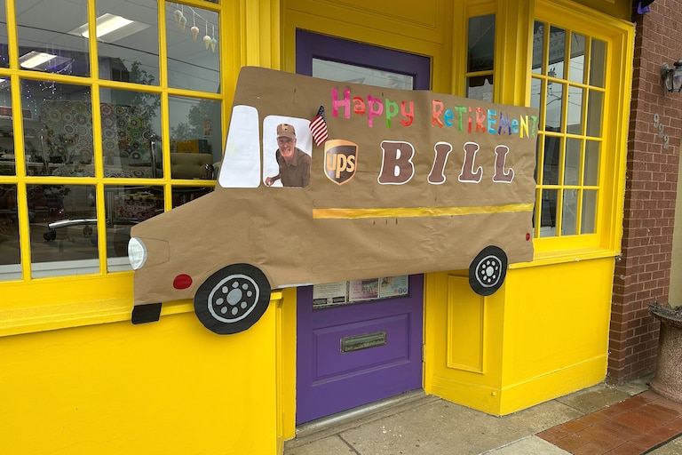 Better World Imaginarium, a Frederick Road toy store, hung a cutout of a UPS truck to honor Bill Trentler’s retirement.