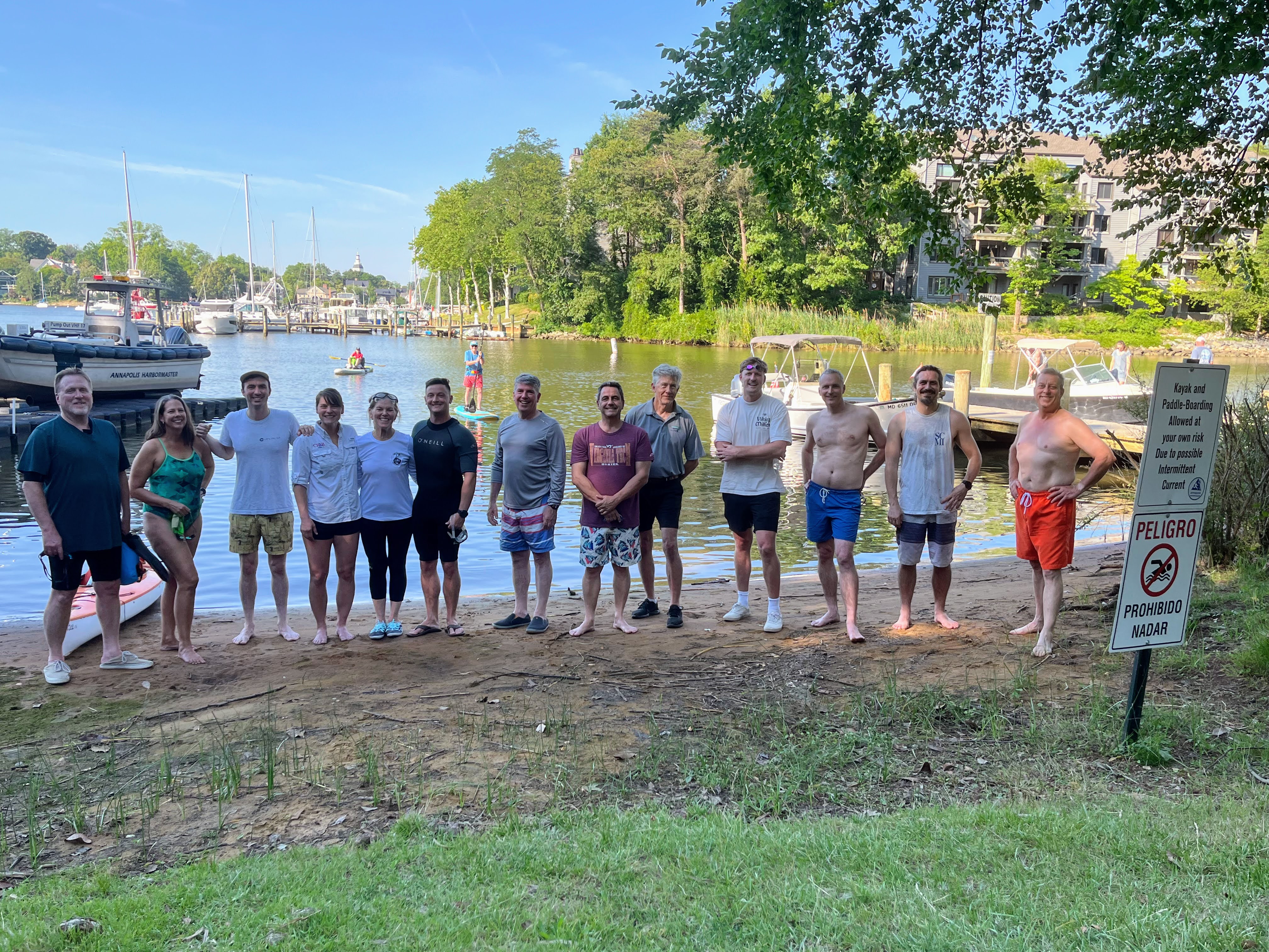 Twelve swimmers and I prepare to swim across Spa Creek, from Truxtun Park to Amos Garrett Park. That's me on the left.