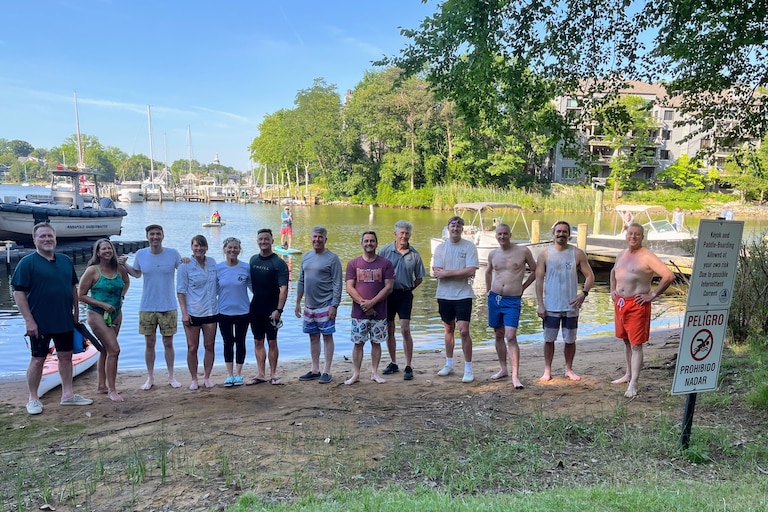 Twelve swimmers and I prepare to swim across Spa Creek, from Truxtun Park to Amos Garrett Park. That's me on the left.