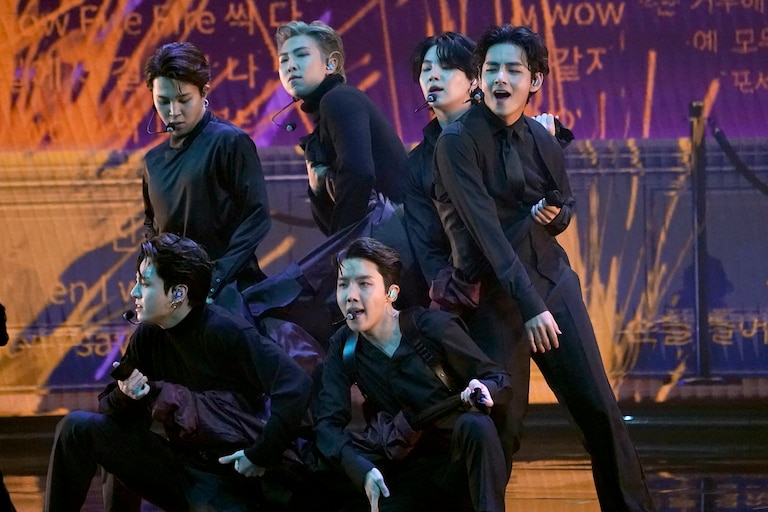 FILE - BTS performs "Butter" at the 64th Annual Grammy Awards on April 3, 2022, in Las Vegas. The surprise announcement by BTS that they were taking a break to focus on members’ solo projects stunned their global fanbase, shaking their label's stock price and leaving many questions about the K-pop supergroup’s future. (AP Photo/Chris Pizzello, File)