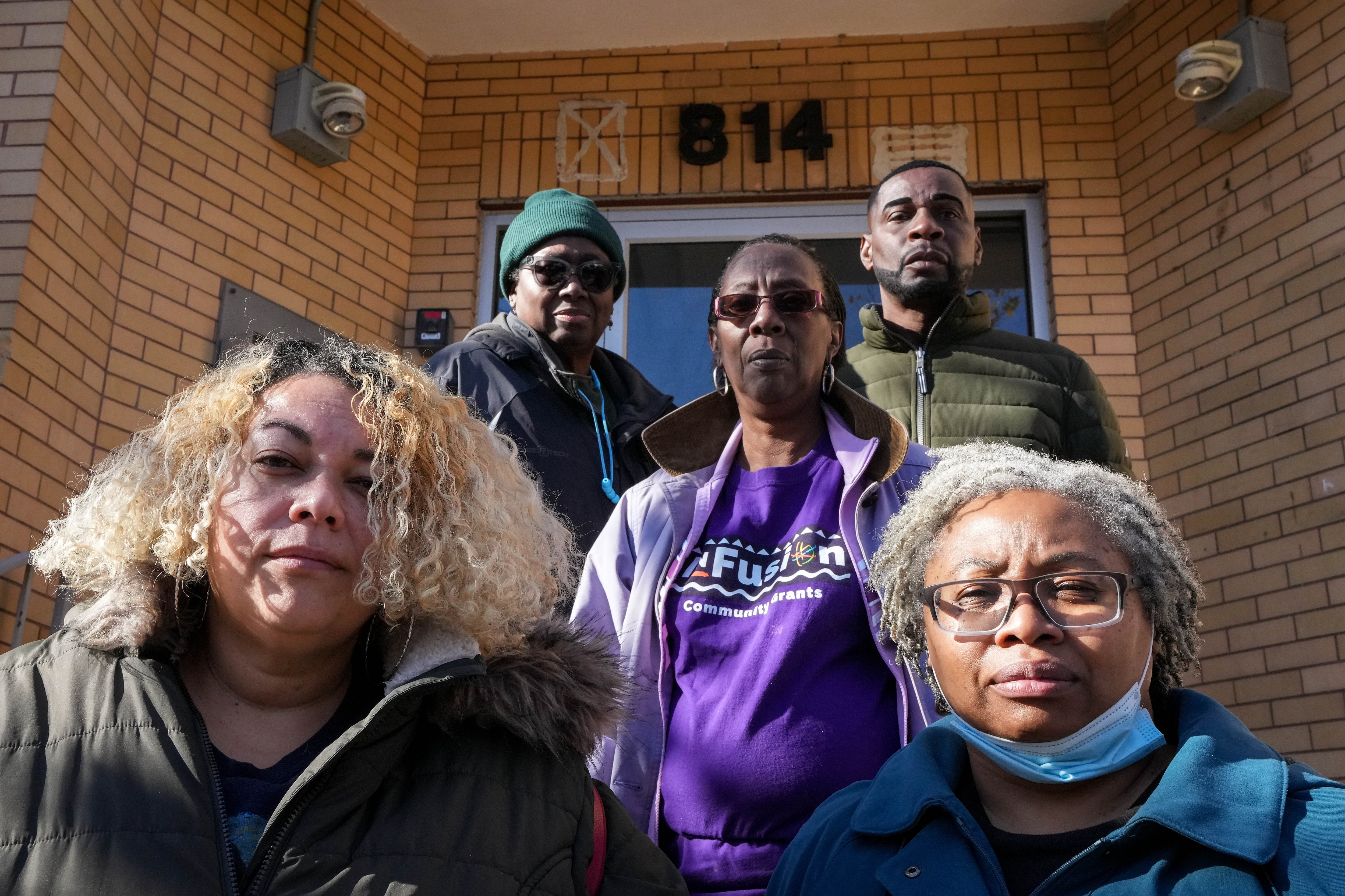 From left: Allison Duggan, Cynthia Gross, Shaerrod Wood, Donald Gresham and Francine Wilks stand for a portrait in front of 814 N. Collington Ave. on 11/19/22. The 814 Coalition is a group of community members trying to keep the MICA Place building available for community members’ use.