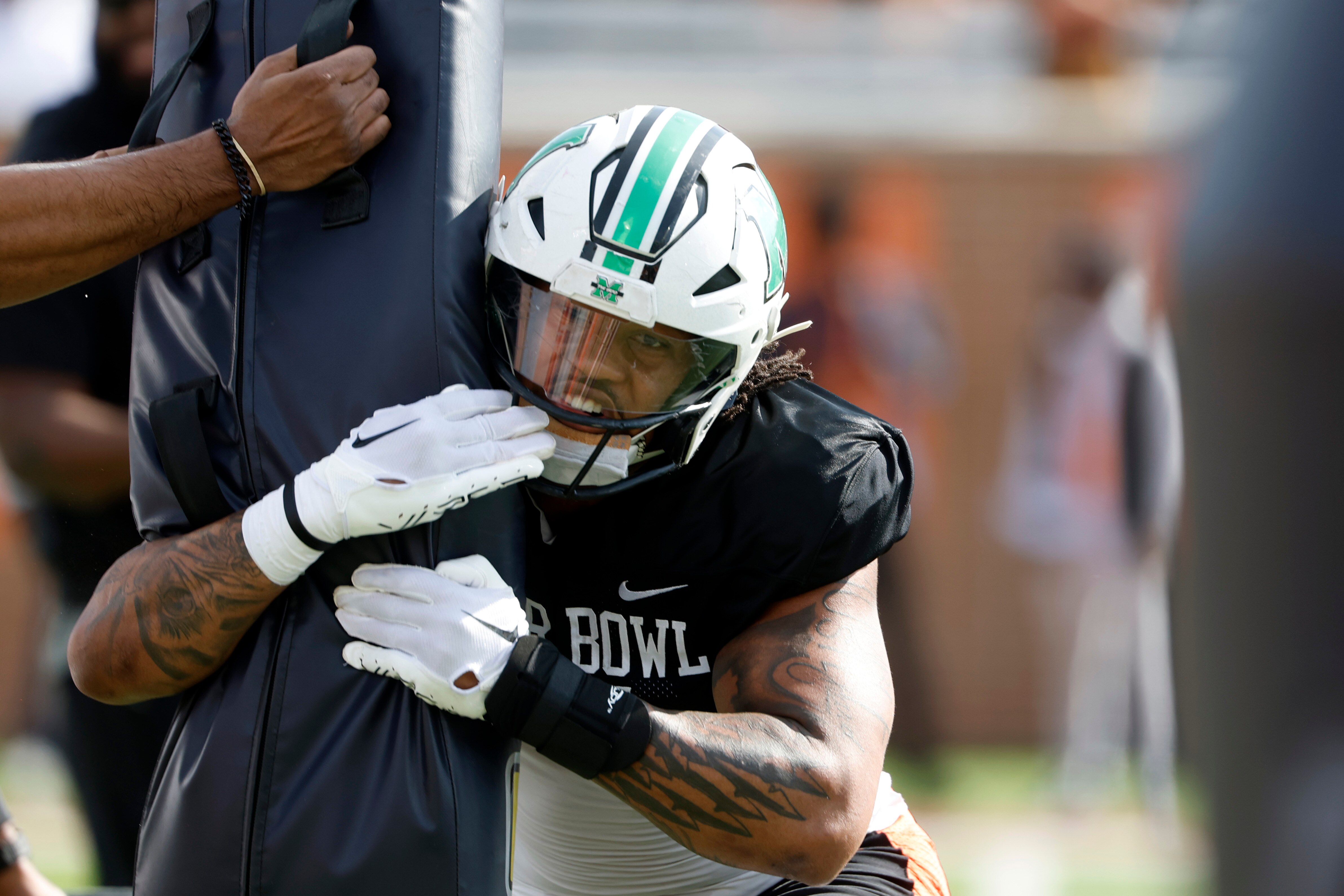 Marshall defensive lineman Mike Green, the Ravens’ first-round draft pick, participates in drills at the Senior Bowl.