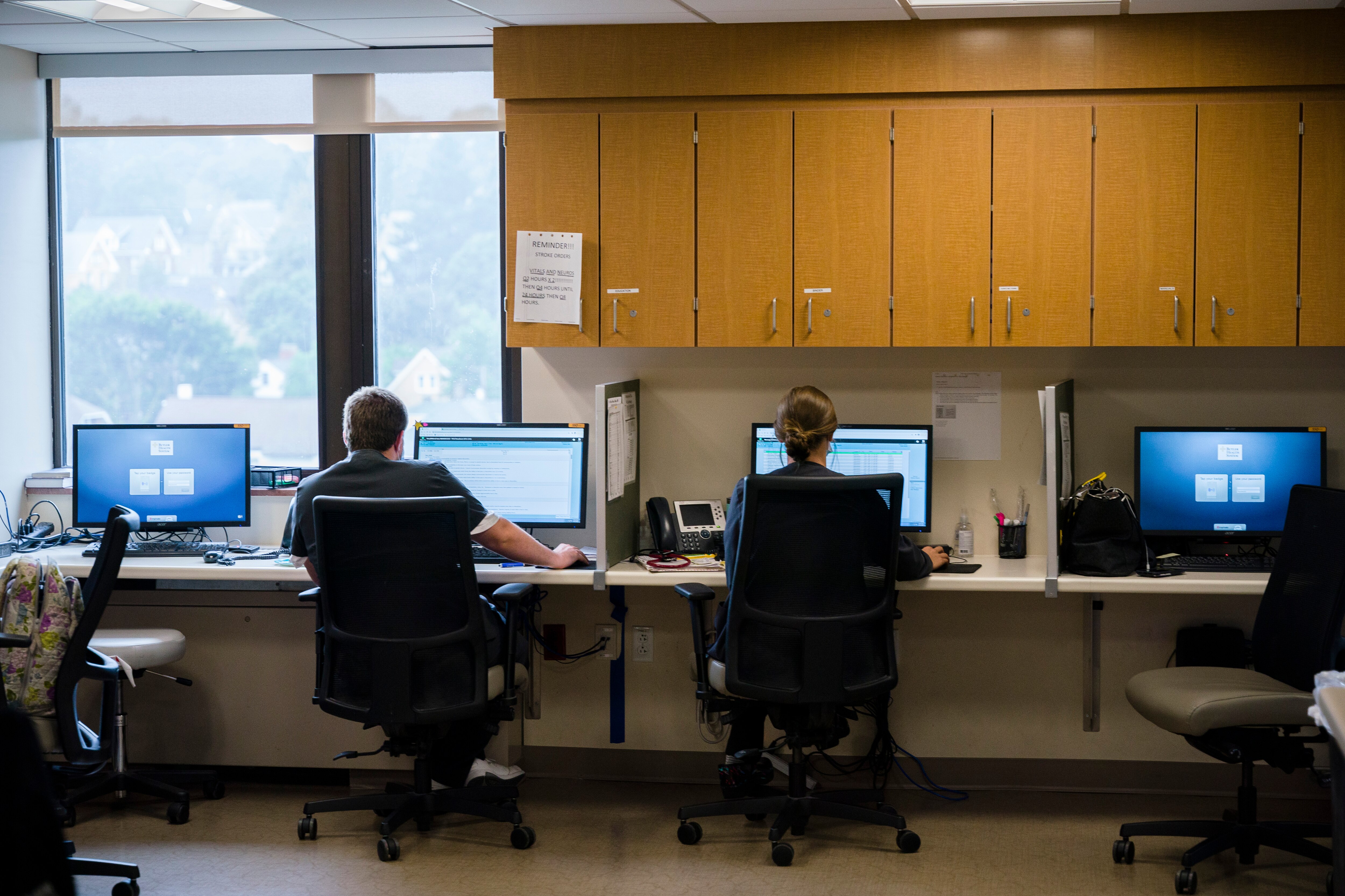 Hospital staff work on computers at a nurses’ station in Butler Memorial Hospital in Butler, Pa., Sunday, Sept. 11, 2022.