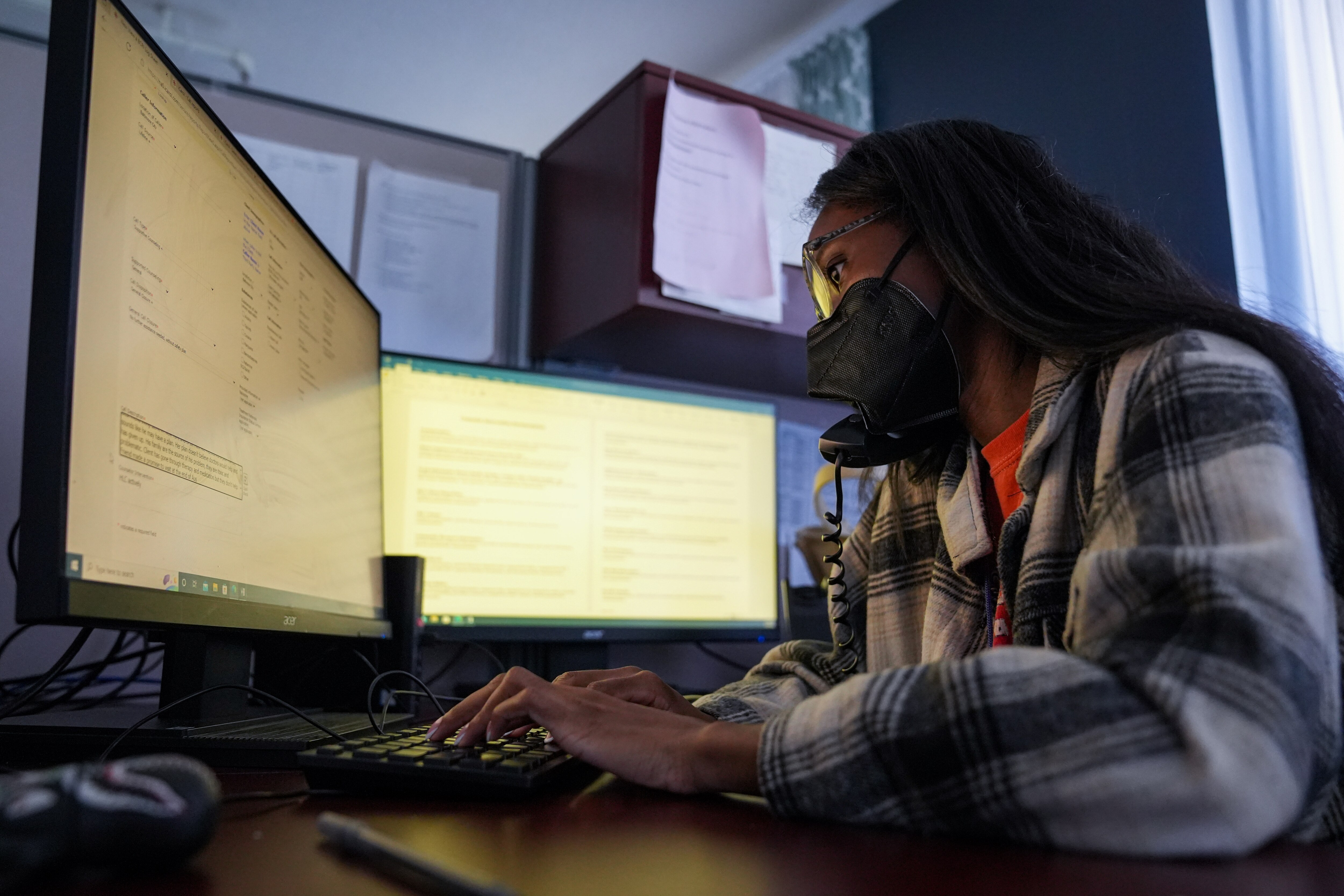 6/30/22—Naomi Glao, a hotline counselor, speaks with a caller in the Baltimore Crisis Response center.