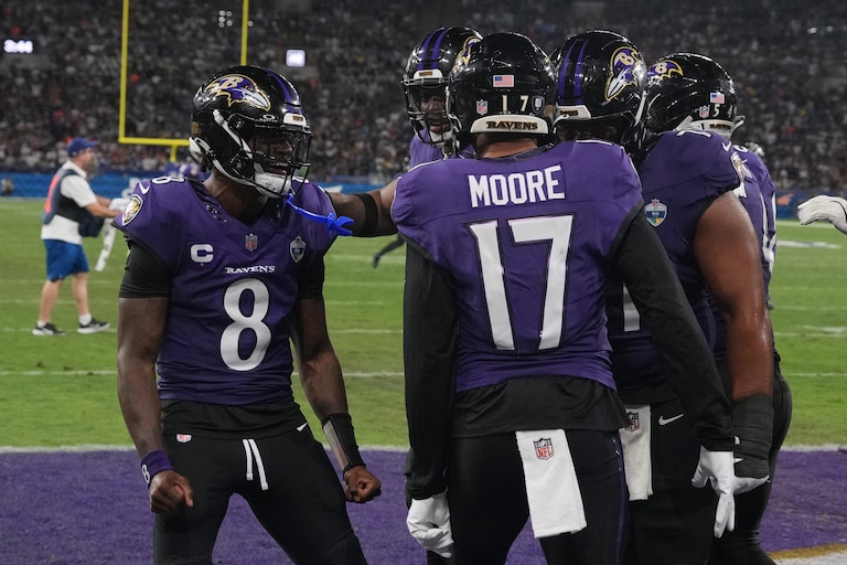 Baltimore Ravens wide receiver Chris Moore (17) celebrates with quarterback Lamar Jackson (8) after a touchdown during the second half of an NFL football game against the Dallas Cowboys in Rio de Janeiro, Sunday, Sept. 27, 2026. (AP Photo/Fernando Llano)