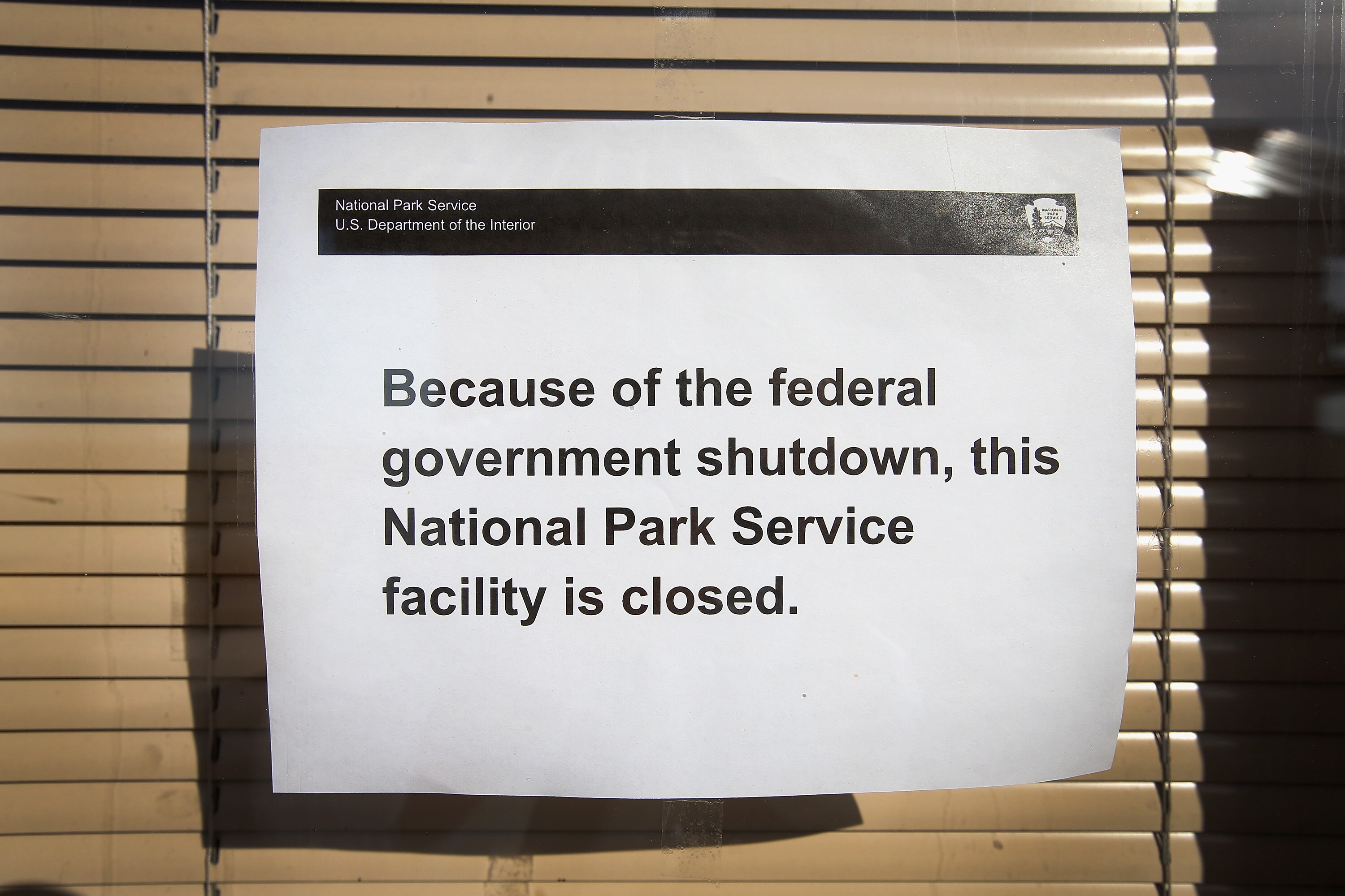 A sign in the Pinnacles Entrance Station of the Badlands National Park warns visitors the park is closed on Oct. 1, 2013 near Wall, South Dakota. Without a spending deal, the federal government could shut down beginning Sunday.