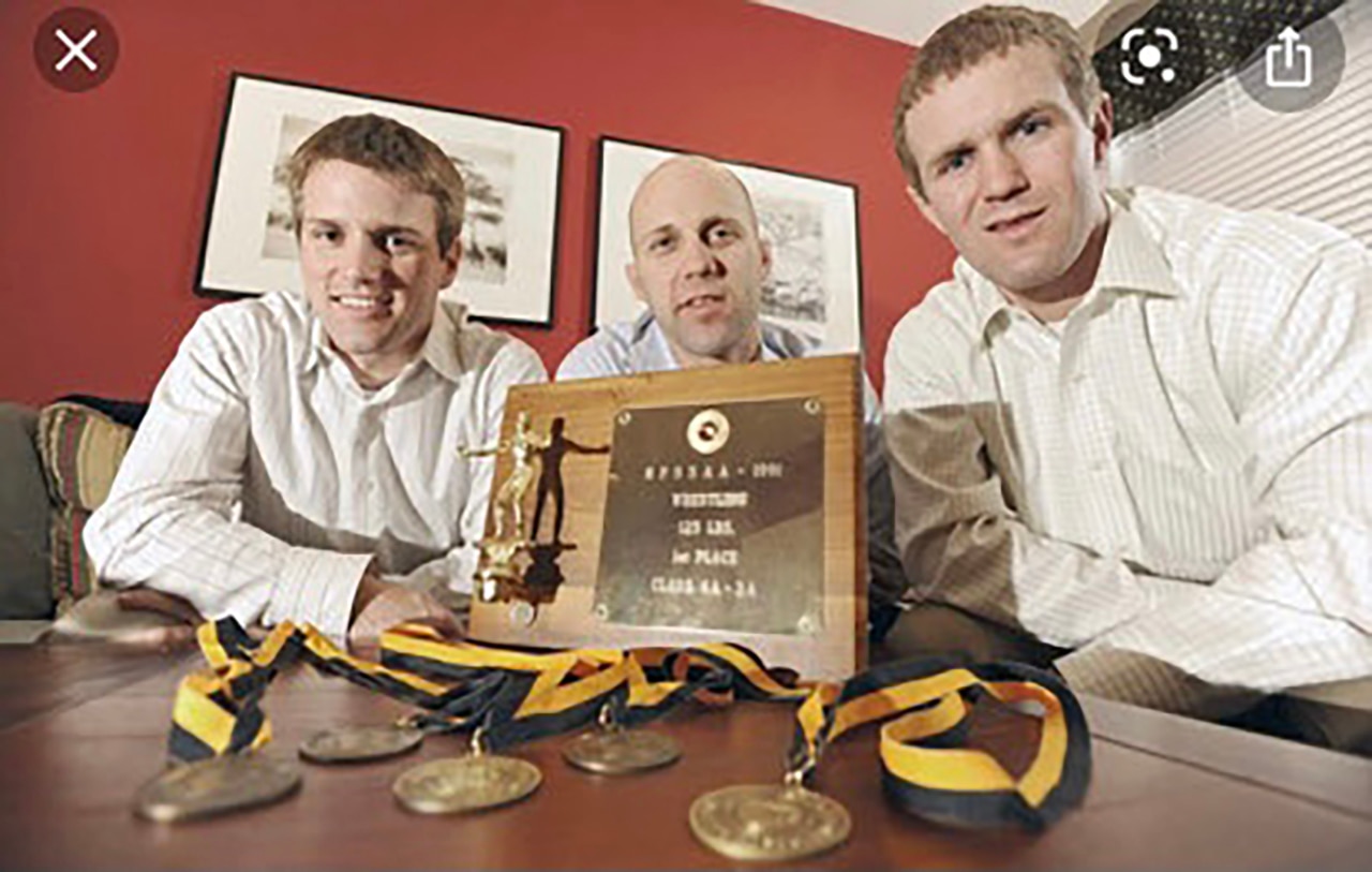 Eveleth Siblings Brian (left) and Matt (right) coached an eighth-grade Toby (center) to a third-place finish at junior league states. "He was a big brother and mentor to Toby," Brian said of Matt, who died of pancreatic cancer in July 2021.