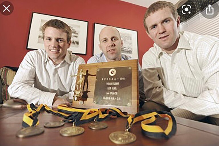 Eveleth Siblings Brian (left) and Matt (right) coached an eighth-grade Toby (center) to a third-place finish at junior league states. "He was a big brother and mentor to Toby," Brian said of Matt, who died of pancreatic cancer in July 2021.