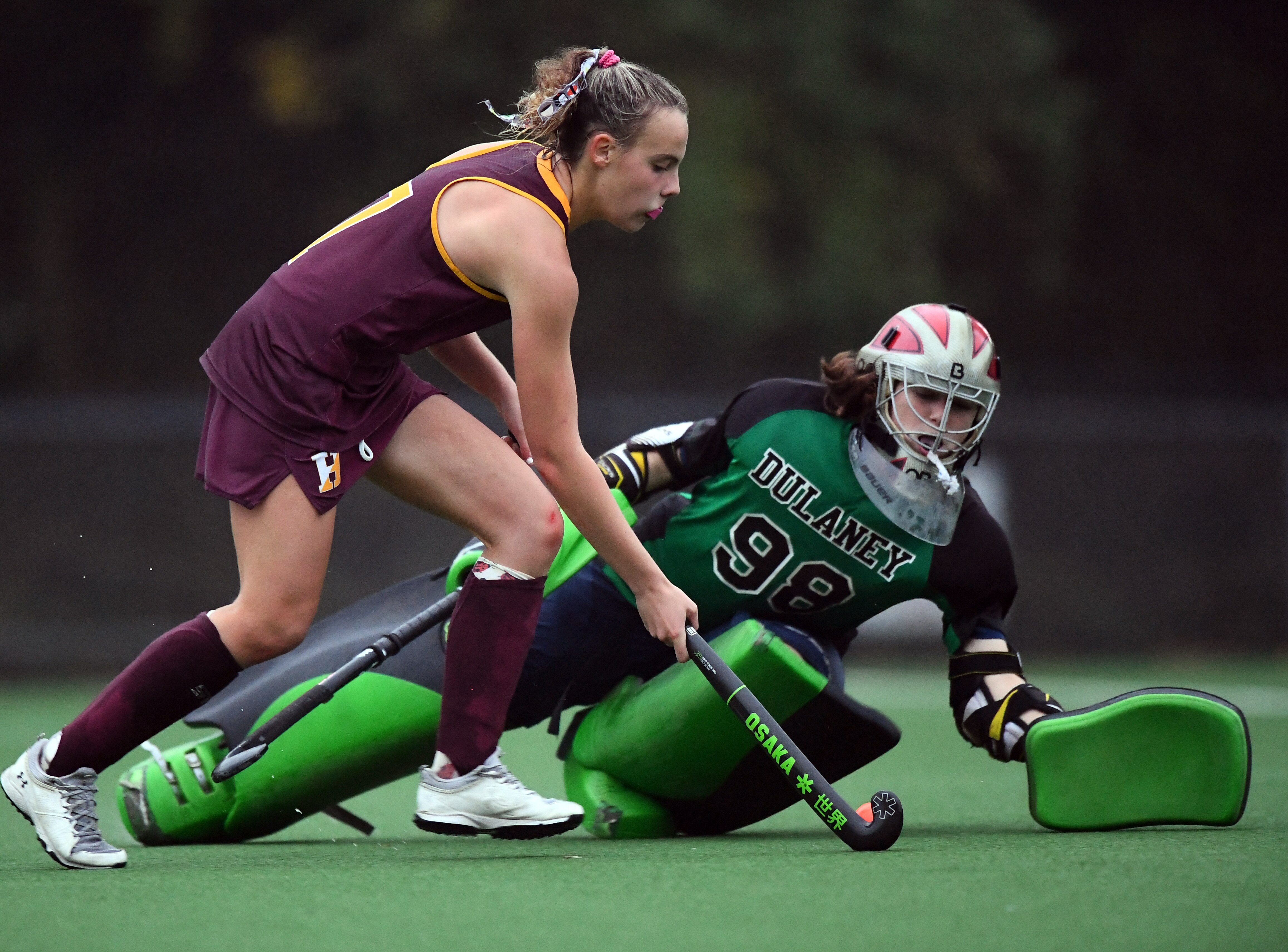 Hereford's Caitlin Meeker (left) tries avoid Dulaney goalie Addie Erdman during last week's Baltimore County field hockey championship game. The Bulls and Lions advanced to the Class 2A and 4A state quarterfinals, respectively, after winning region final contests Wednesday.