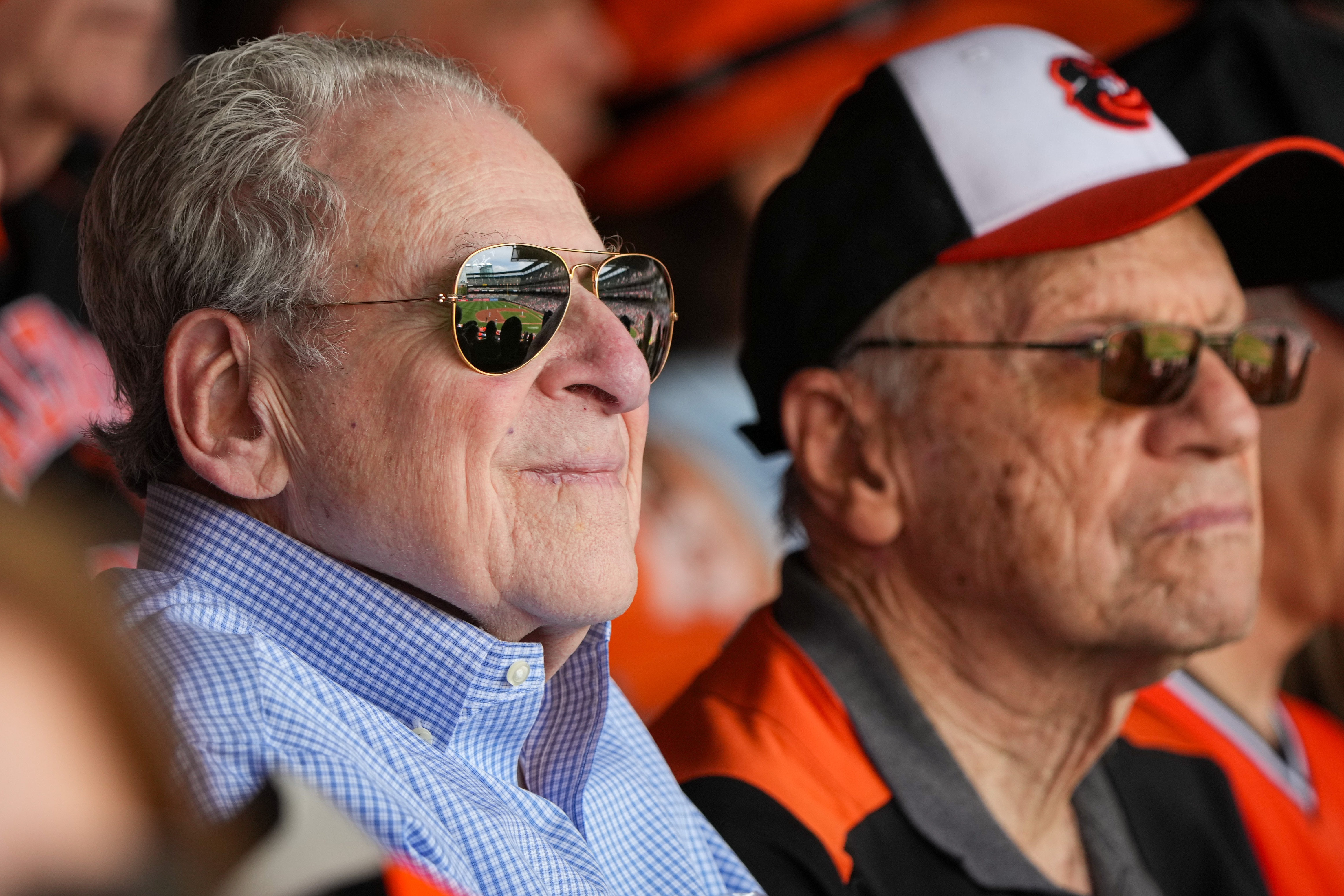 Ernie Feibelman watches a baseball game between the Baltimore Orioles and Chicago White Sox at Camden Yards on Wednesday, August 30. Feibelman, a Holocaust survivor, has loved baseball ever since he arrived in America. When he mentioned he wished he could see the Orioles again in person, the Edward A. Myerberg Center staff organized a trip for him and other seniors.