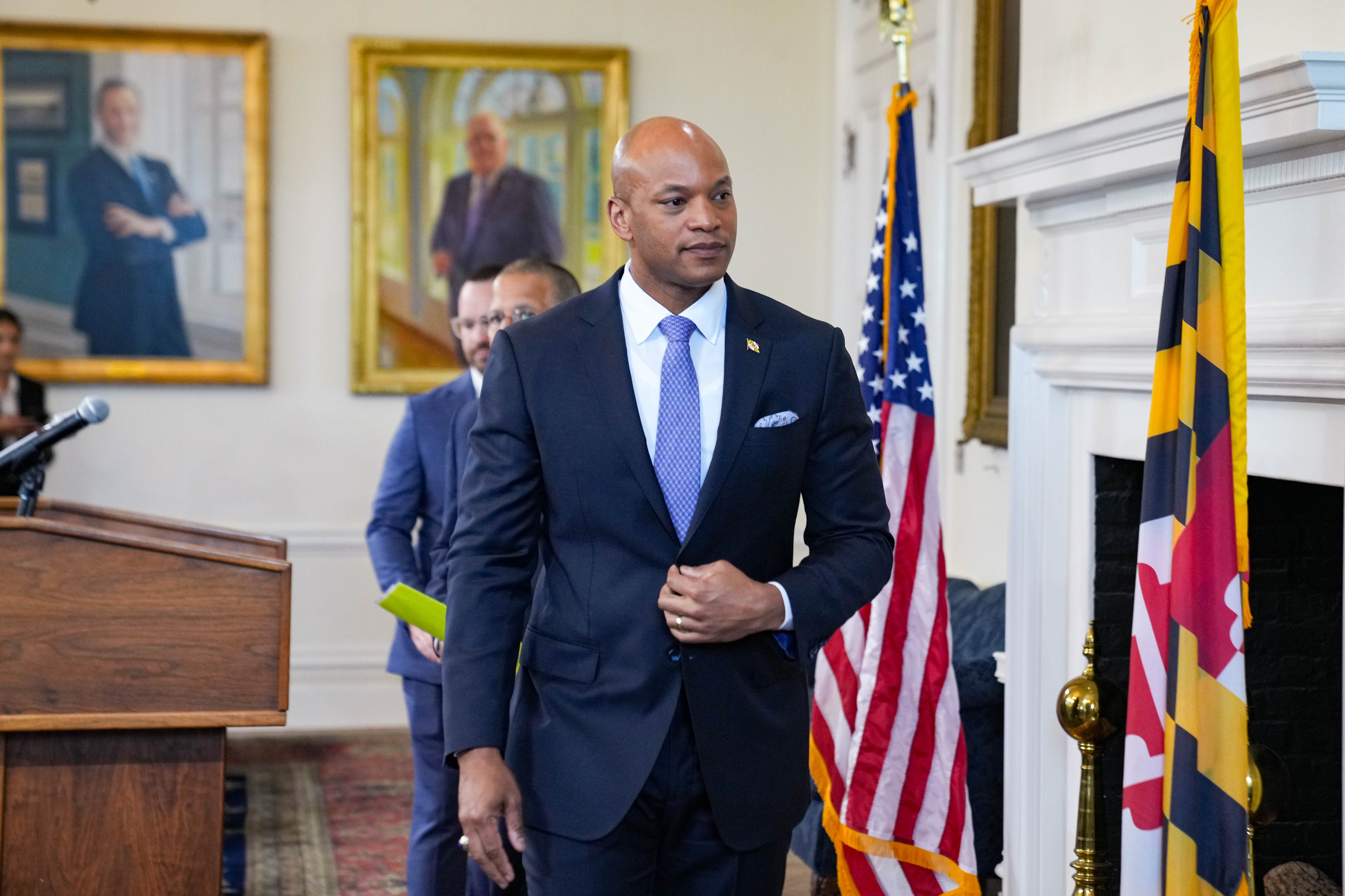 Gov. Wes Moore returns to his office as reporters continue to shout questions toward him following a news conference at the Maryland State House in Annapolis on Thursday, May 15, 2025.