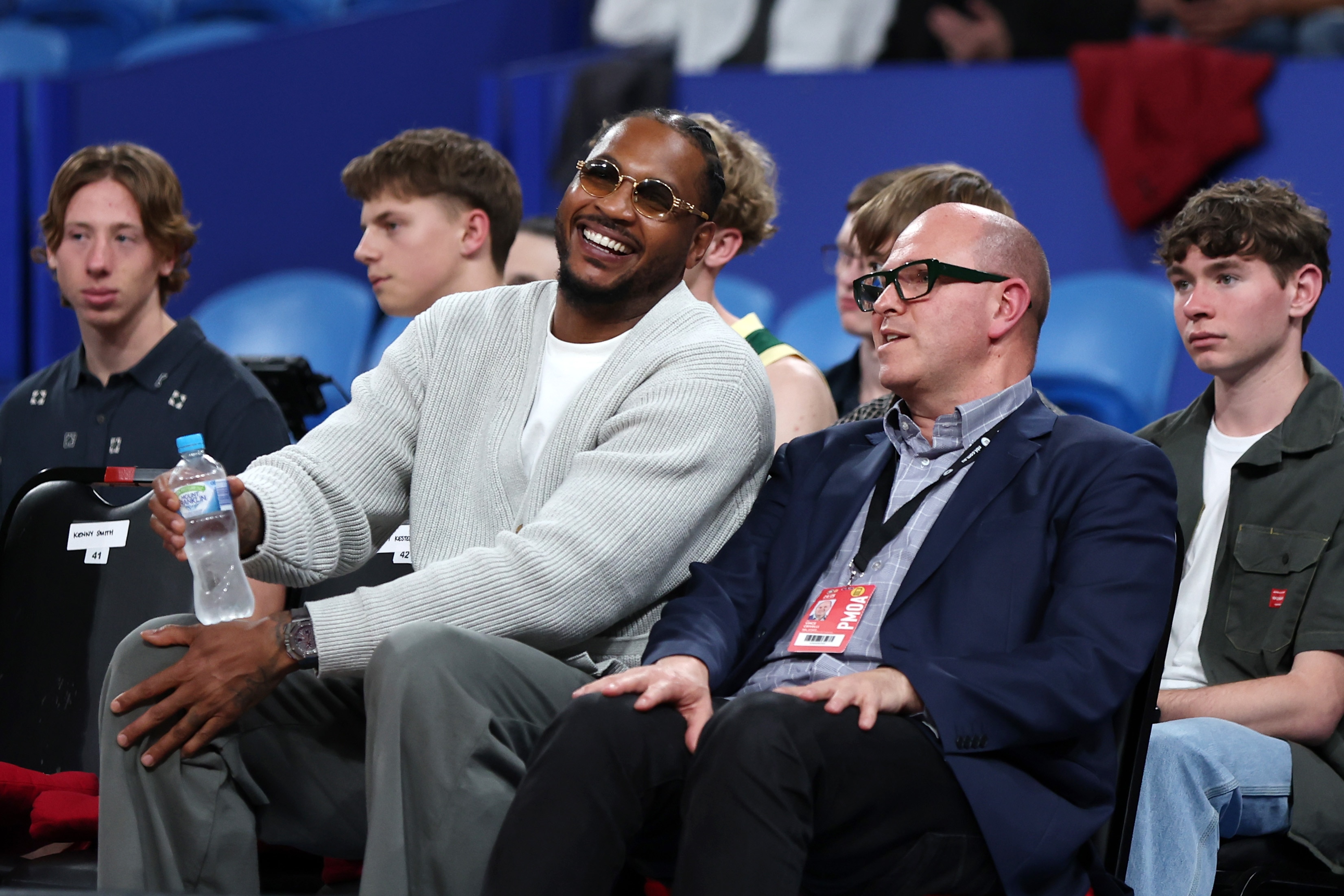Carmelo Anthony, shown here watching professional basketball in Australia, is hoping to spark a basketball renaissance in Baltimore. 