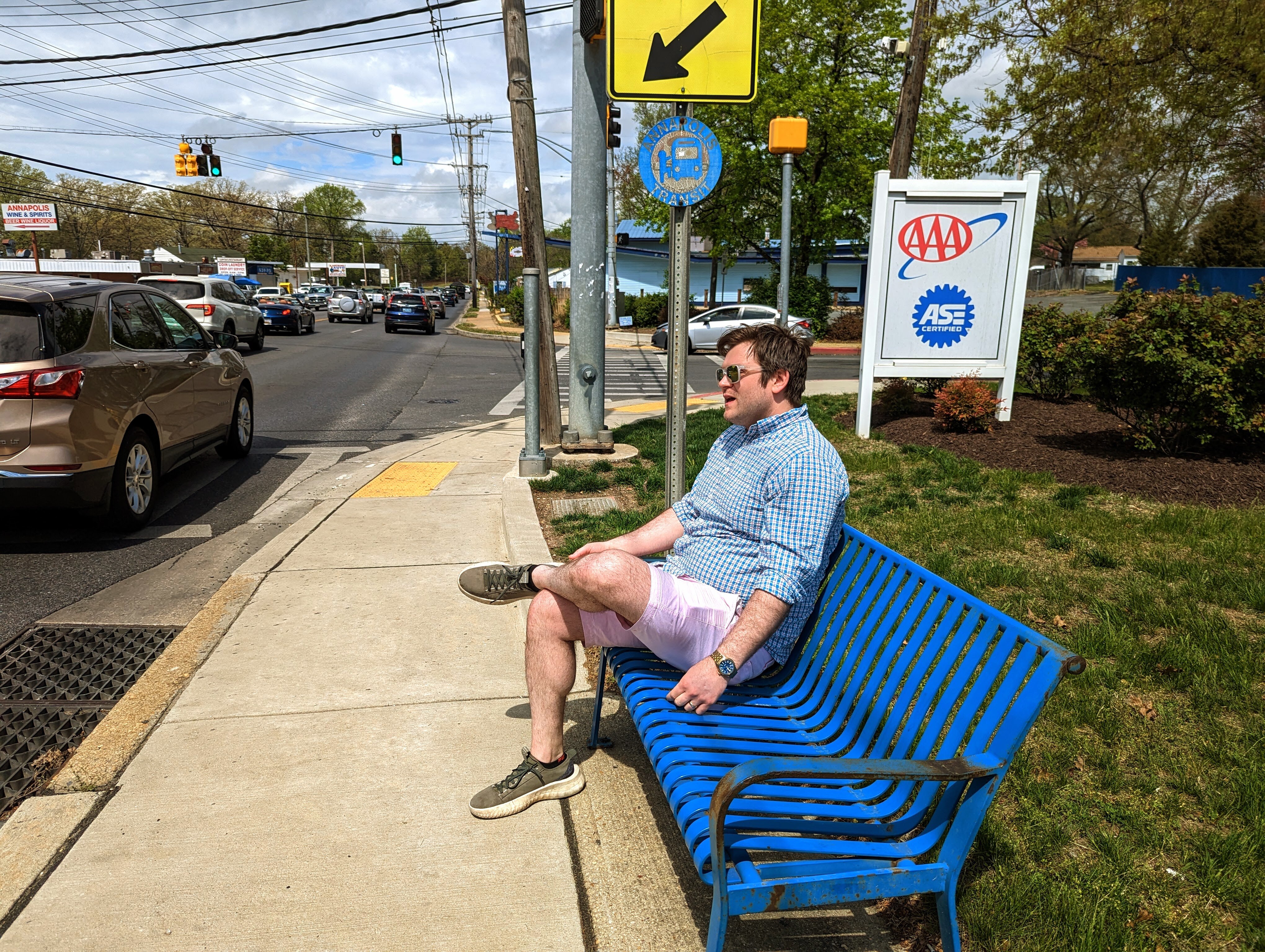 Alderman Brooks Schandelmeier shouts over traffic noise from an uncovered bus stop on Forest Drive at Tyler Avenue. He said he could see the intersection one day being a mix of new commercial space and housing, situated around a traffic circle to slow cars.