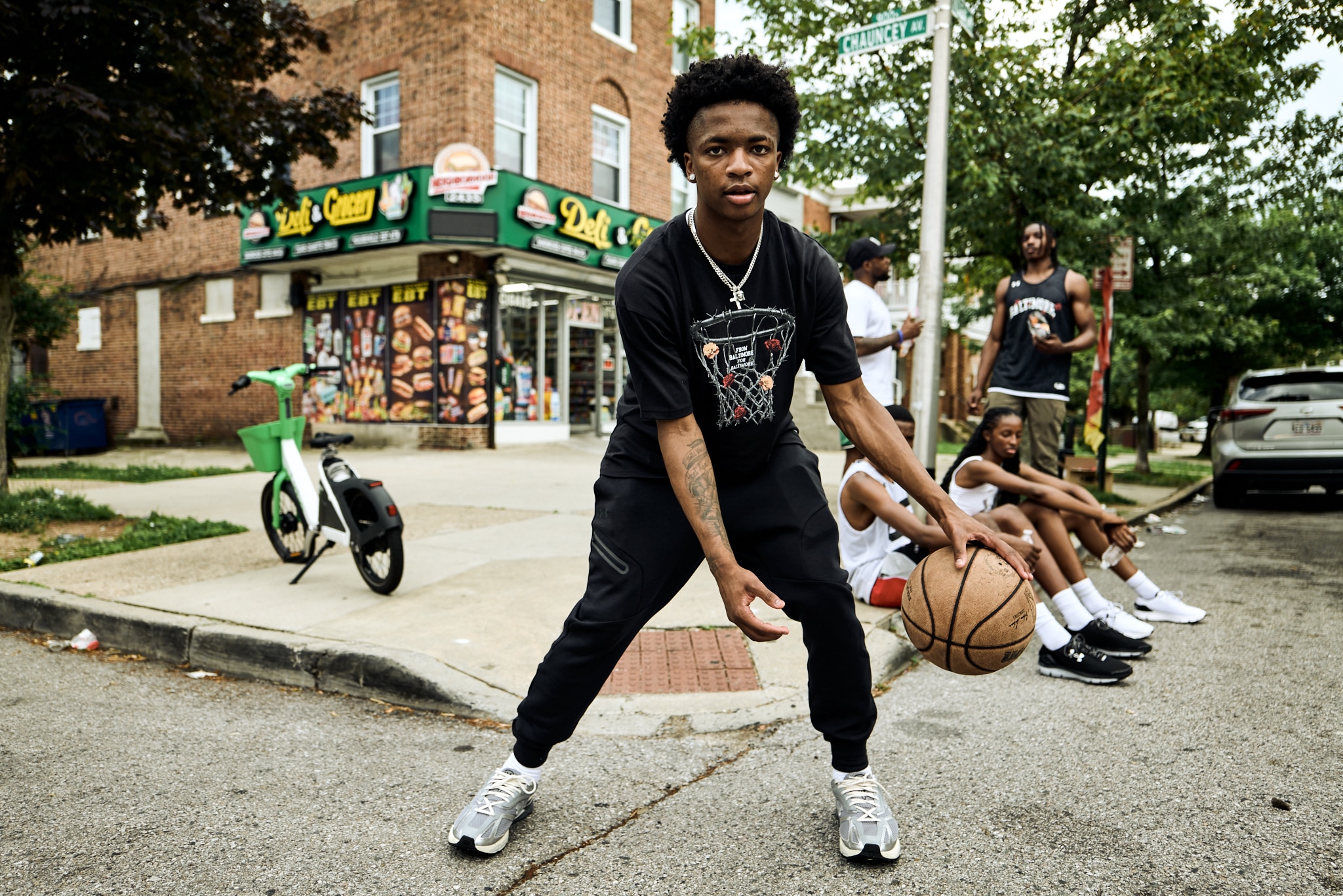 A member of Team Thrill wears a T-shirt from Devin Allen's "Rose" collection with Under Armour.