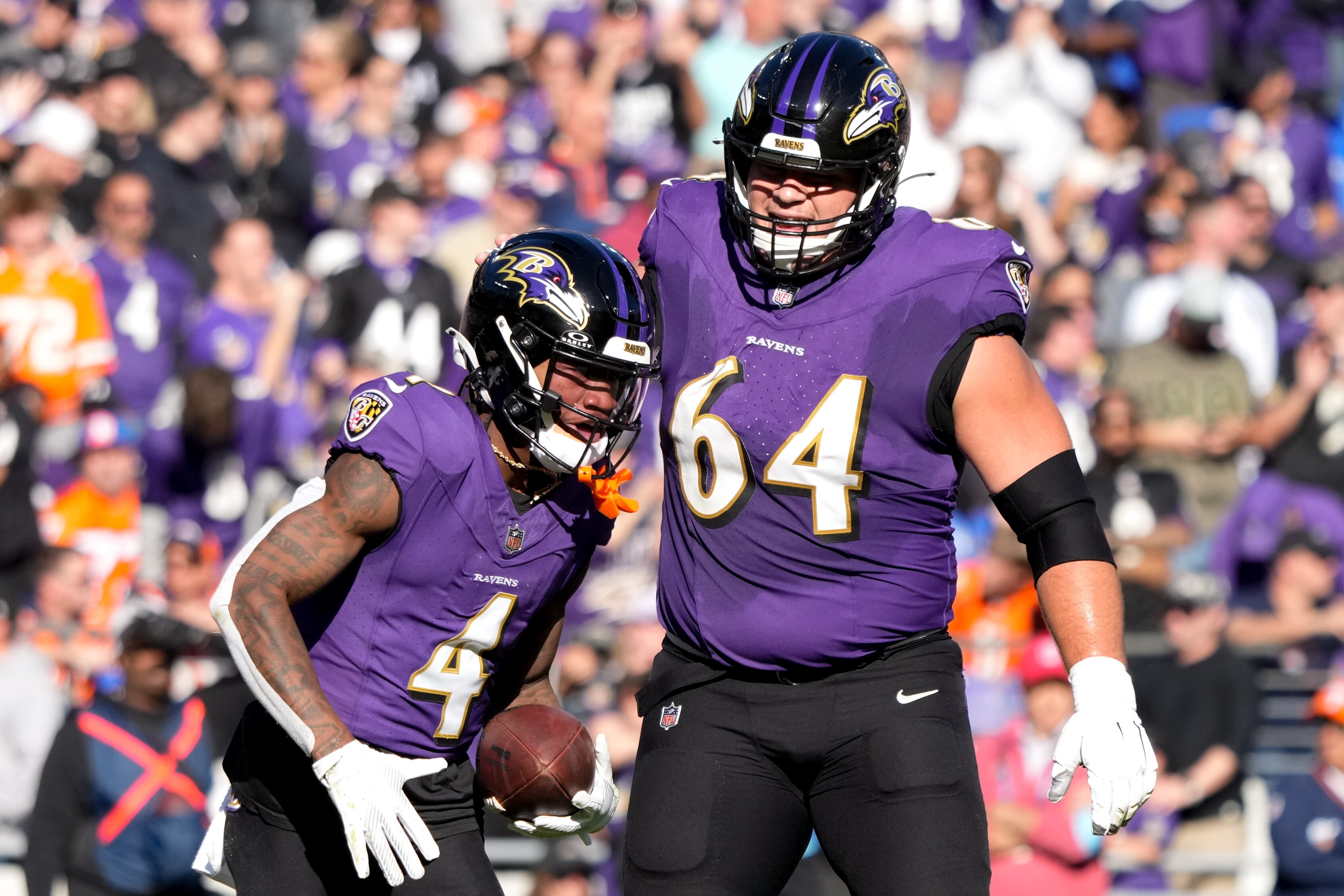 Ravens wide receiver Zay Flowers (left) celebrates a touchdown with center Tyler Linderbaum against the Denver Broncos.