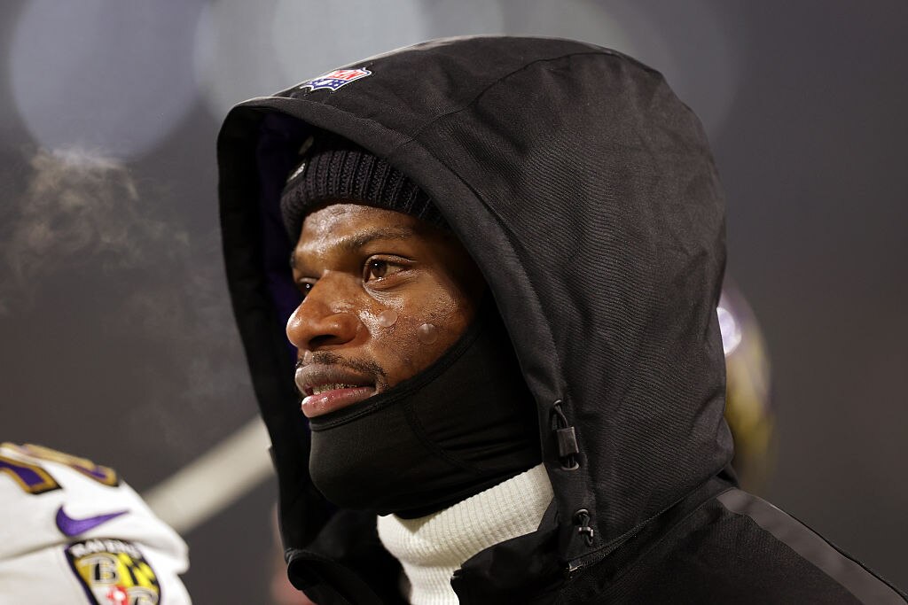 Ravens quarterback Lamar Jackson looks on before the team's game against the Green Bay Packers.