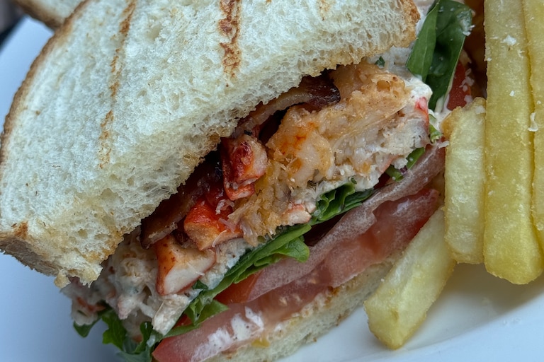 Ampersea's seafood club sandwich also comes with bacon, lettuce and tomato.