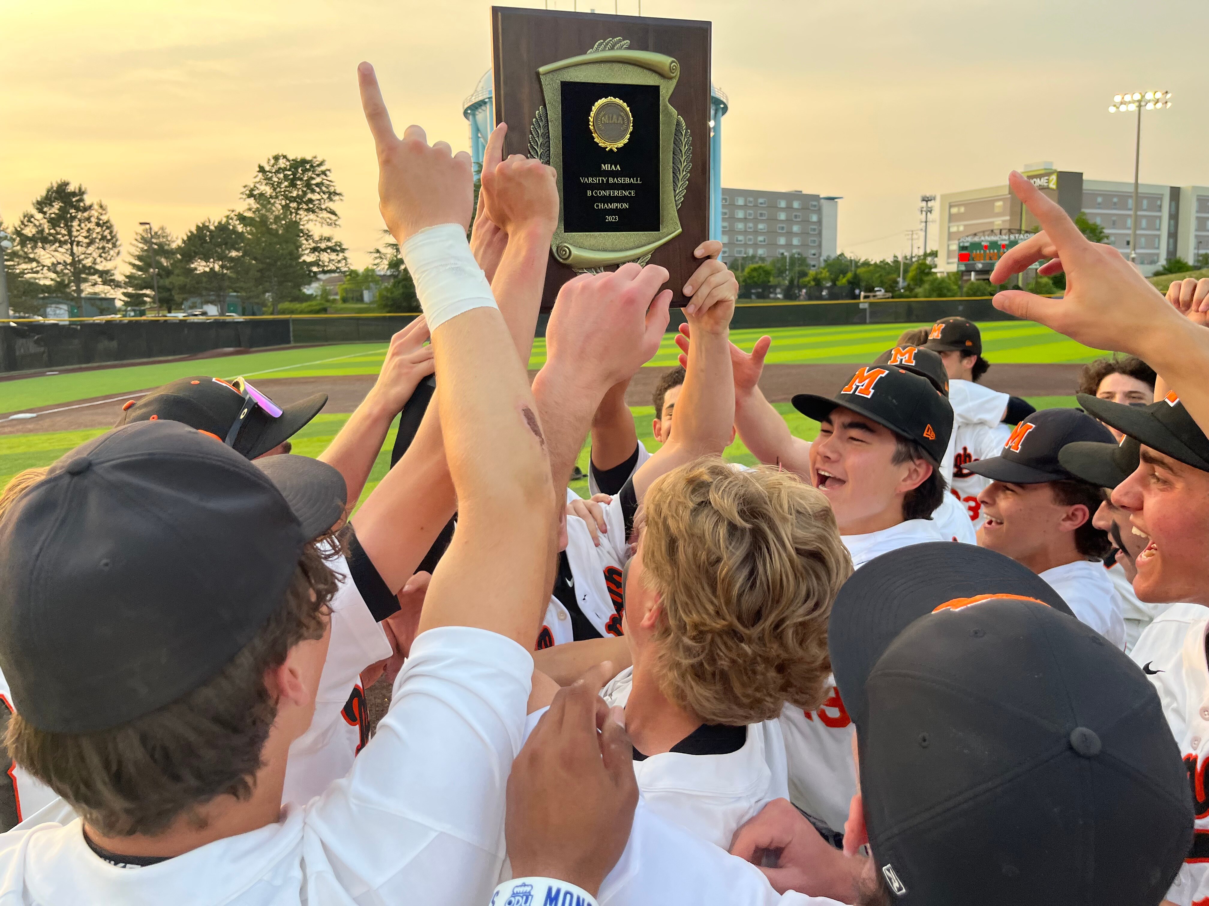 McDonogh's baseball team celebrates with the MIAA B Conference plaque Monday. The Eagles won their first title since claiming Maryland Scholastic Association A crown in 1992 with a 2-0 victory over Gerstell Academy at Joe Cannon Stadium.