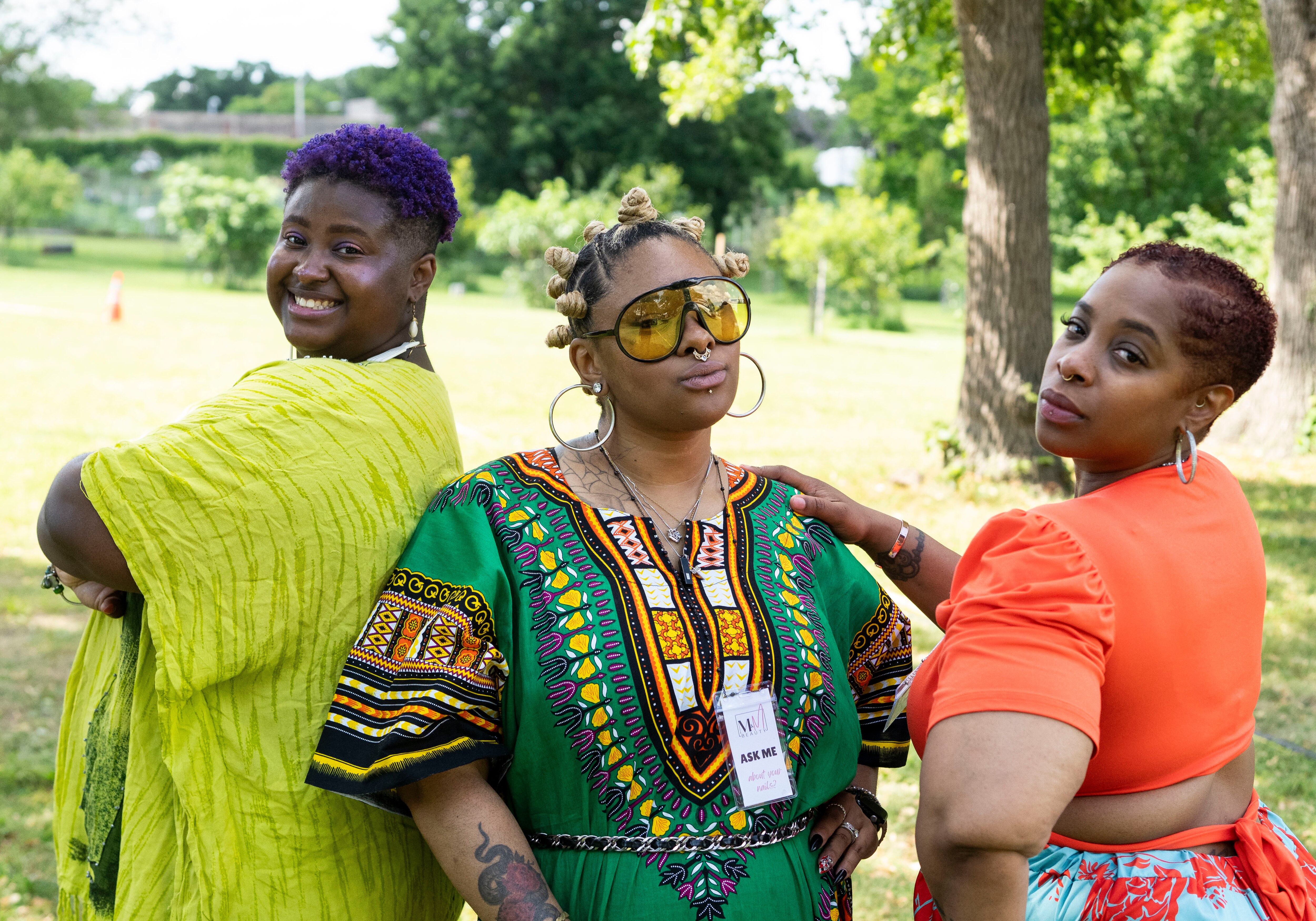 From left, Unyque Burnette, Jakita Townes and Shawn Jordan at AFRAM’s 50th anniversary in Druid Hill Park on Friday.
