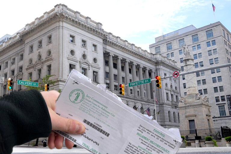 Baltimore Banner courts reporter Dylan Segelbaum‘s trial jury summons outside the Clarence M. Mitchell Jr. Courthouse on Feb. 12, 2024.