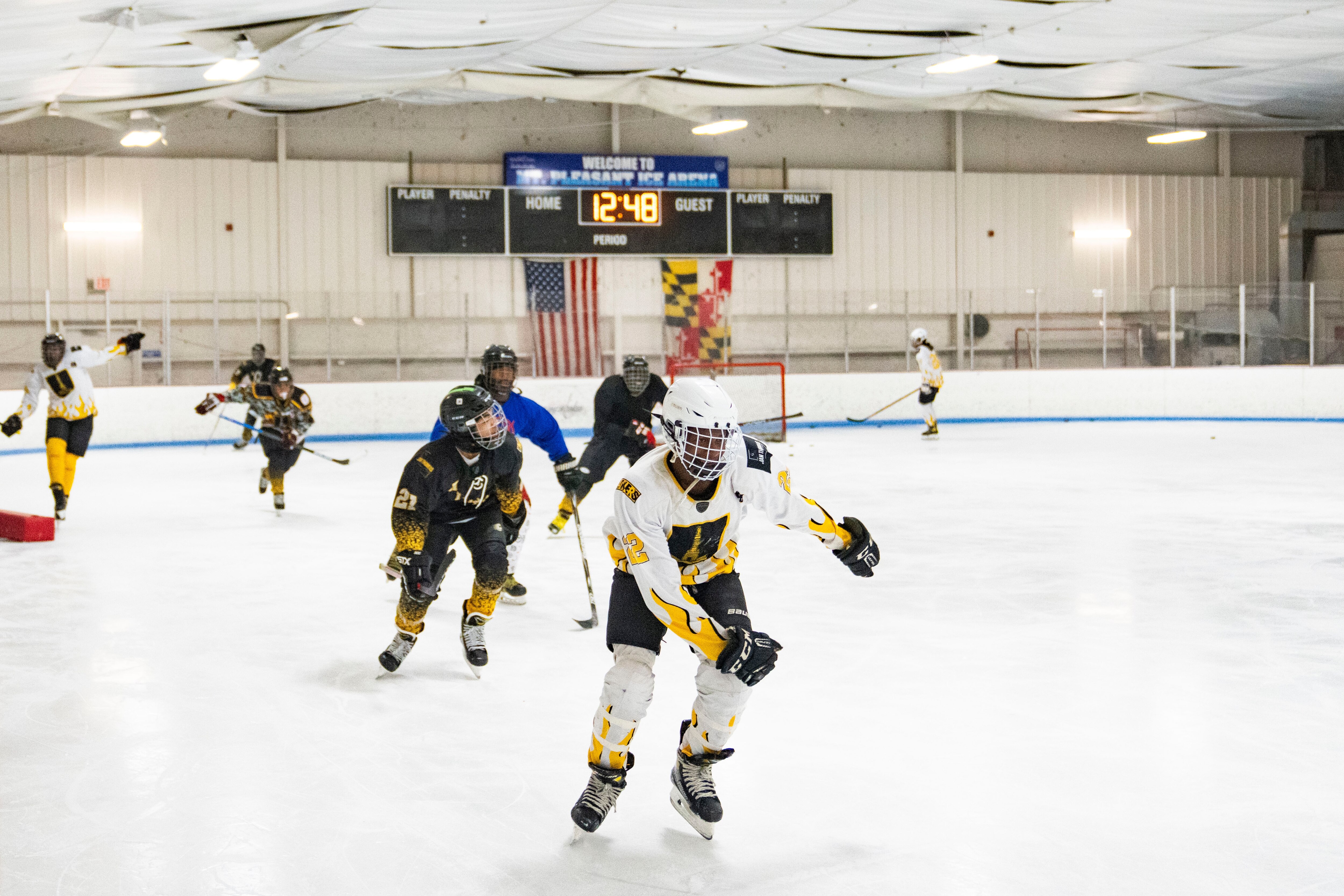 Baltimore Banner hockey players and coaches race each other in laps around the ice rink at Mt. Pleasant Ice Arena, in Baltimore, Saturday, December 20, 2025.
