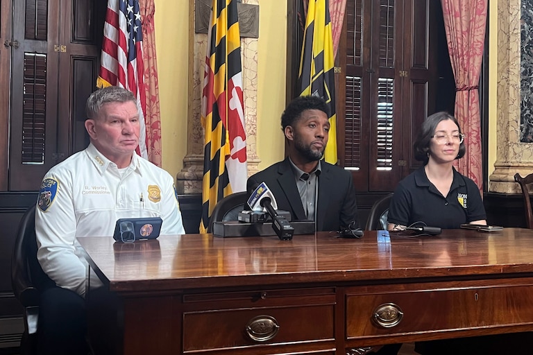 TUESDAY, OCTOBER 20, 2026 - Mayor Brandon Scott, center, with Baltimore Police Commissioner Richard Worley, left, and Stefanie Mavronis, Director of the Mayor's Office of Neighborhood Safety and Engagement, speaks to press after summoning his public safety leadership teams to City Hall to discuss a spate of recent violence on Tuesday.