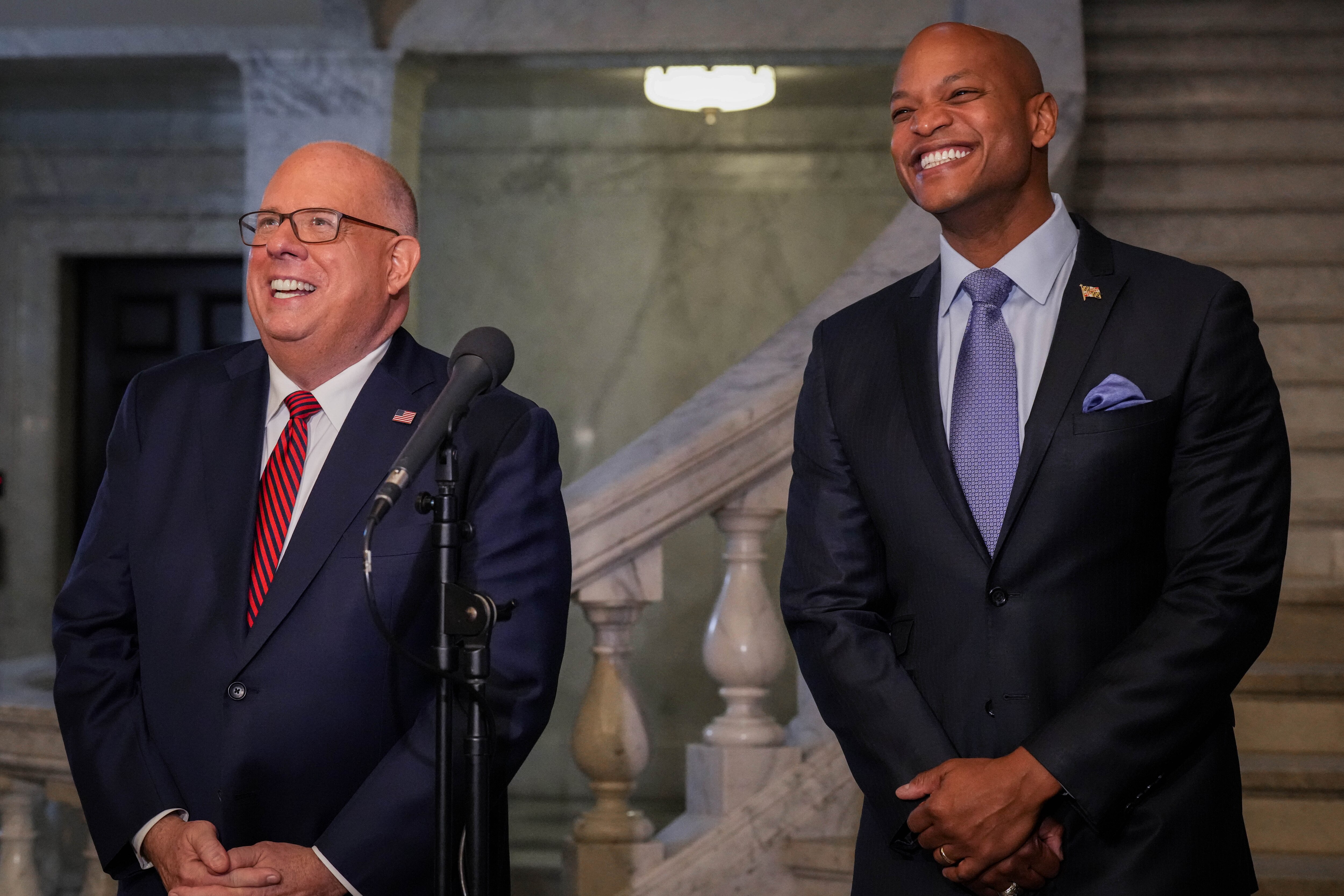 Former Gov. Larry Hogan, left, and Gov. Wes Moore both had significant business deals and investments that they brought with them to public service. A new state law sets a standard for governors going forward.