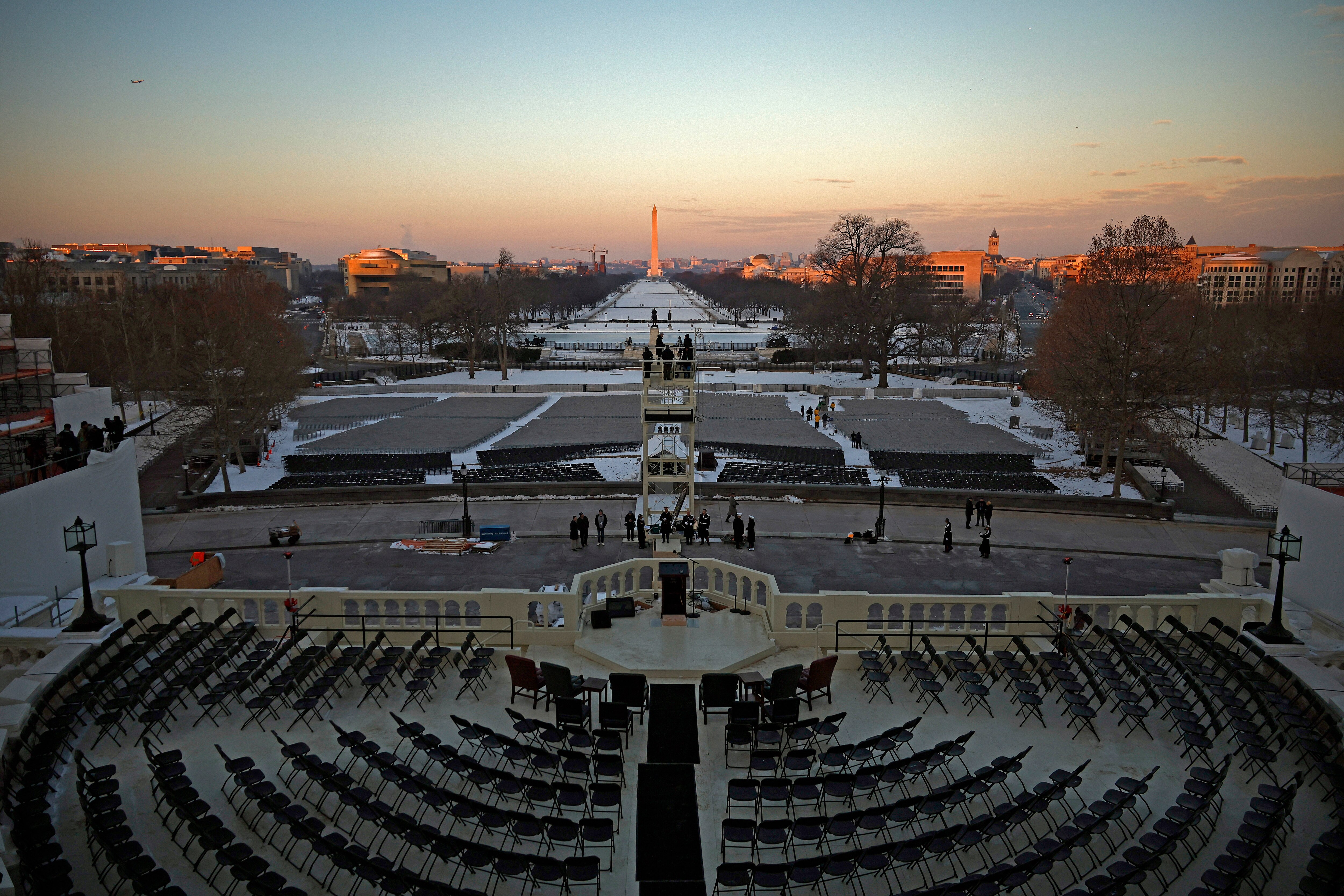 WASHINGTON, DC - JANUARY 12: The sun rises over the National Mall and the inauguration stand as final preparations are make during a rehearsal for inauguration on the West Front of the U.S. Capitol on January 12, 2025 in Washington, DC. U.S. President-elect Donald Trump and Vice President-elect JD Vance will be sworn in on January 20.
