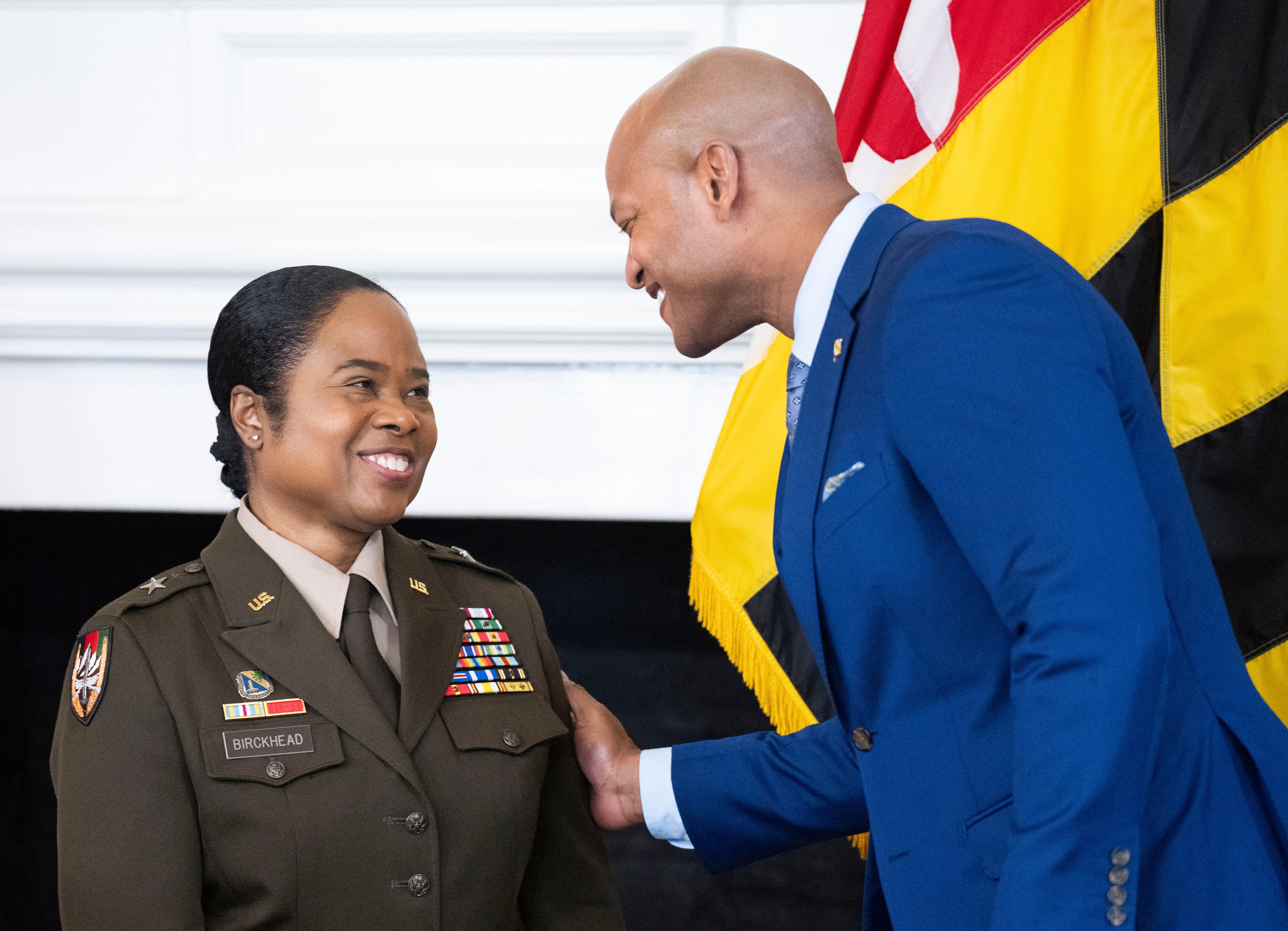 Brig. Gen. Janeen Birckhead and Gov. Wes Moore share a moment during a press conference announcing her nomination for state adjutant general, at the State House in Annapolis, Wednesday, April 5, 2023.
