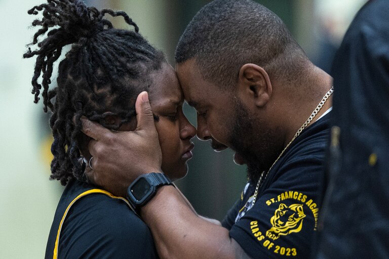 St. Frances Academy's Kameryn Dorsey (3) is consoled by her father, Damon Dorsey, following the IAAM A Girls Championship game in Bel Air, Md., on Monday, February 20, 2023. Dorsey lost ball possession at the final seconds of the game resulting in a late loss. McDonogh defeated St. Frances 50-47 to win the championship
