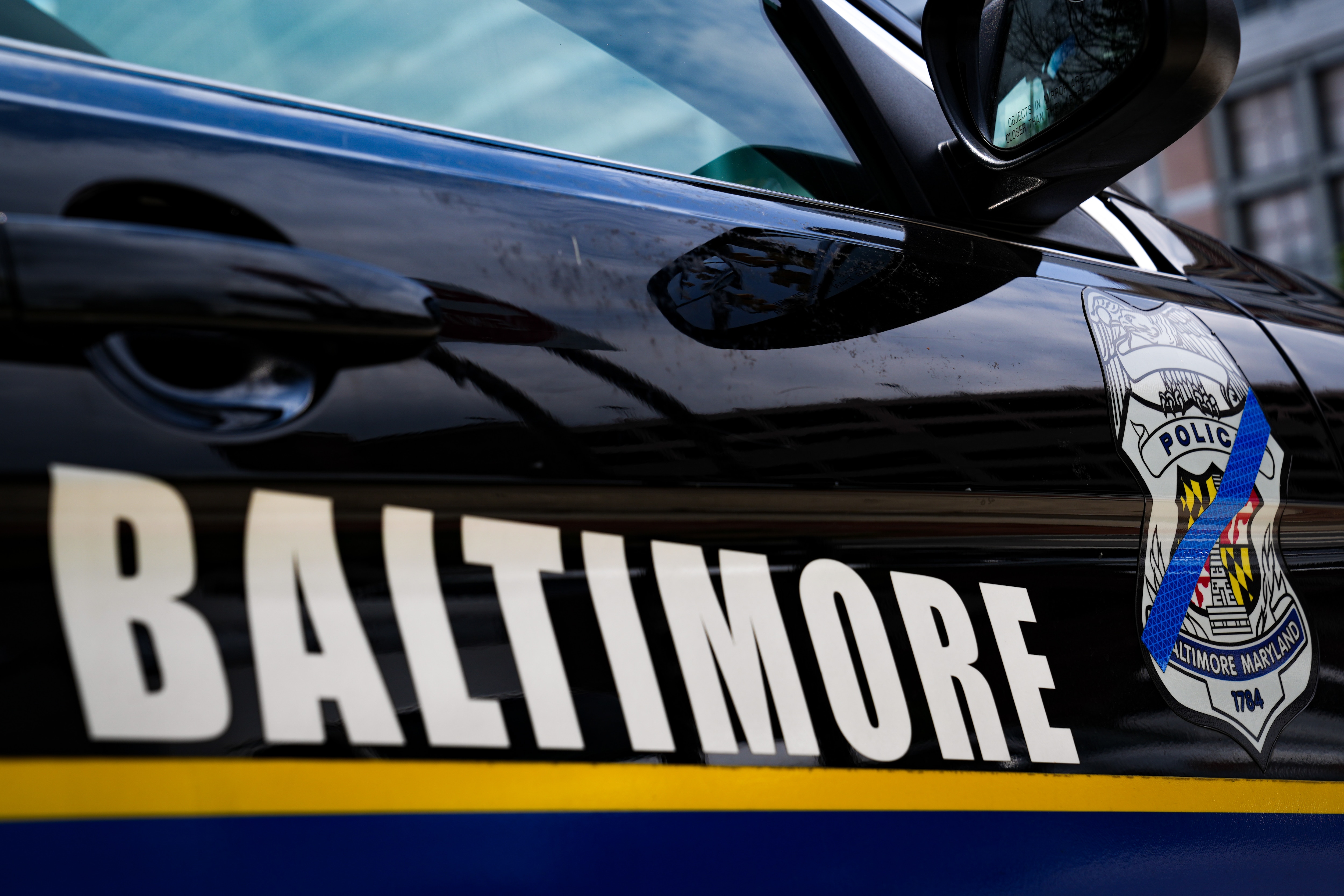 7/8/22—A Baltimore Police officer’s car is parked on the corner of E Lombard St. & President St.