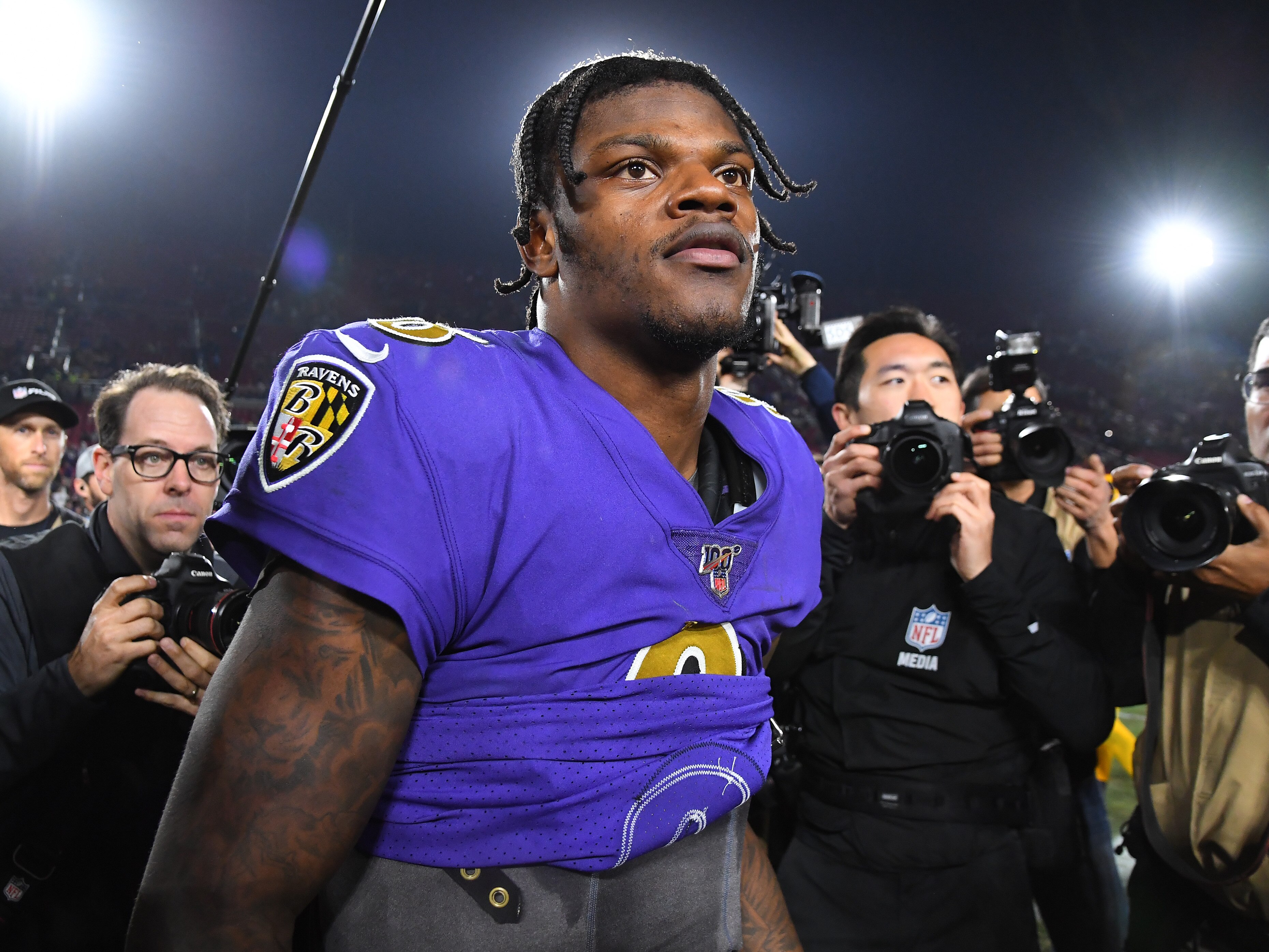 Lamar Jackson #8 of the Baltimore Ravens walks off the field after the game against the Los Angeles Rams at the Los Angeles Memorial Coliseum on November 25, 2019 in Los Angeles, California.