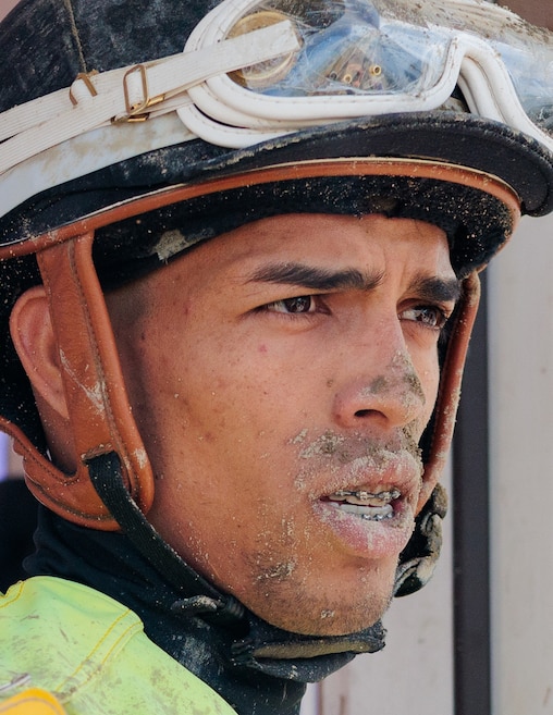 Eighteen-year-old jockey Yedsit Hazlewood is covered in dirt following a race at Laurel Park Race Track.
