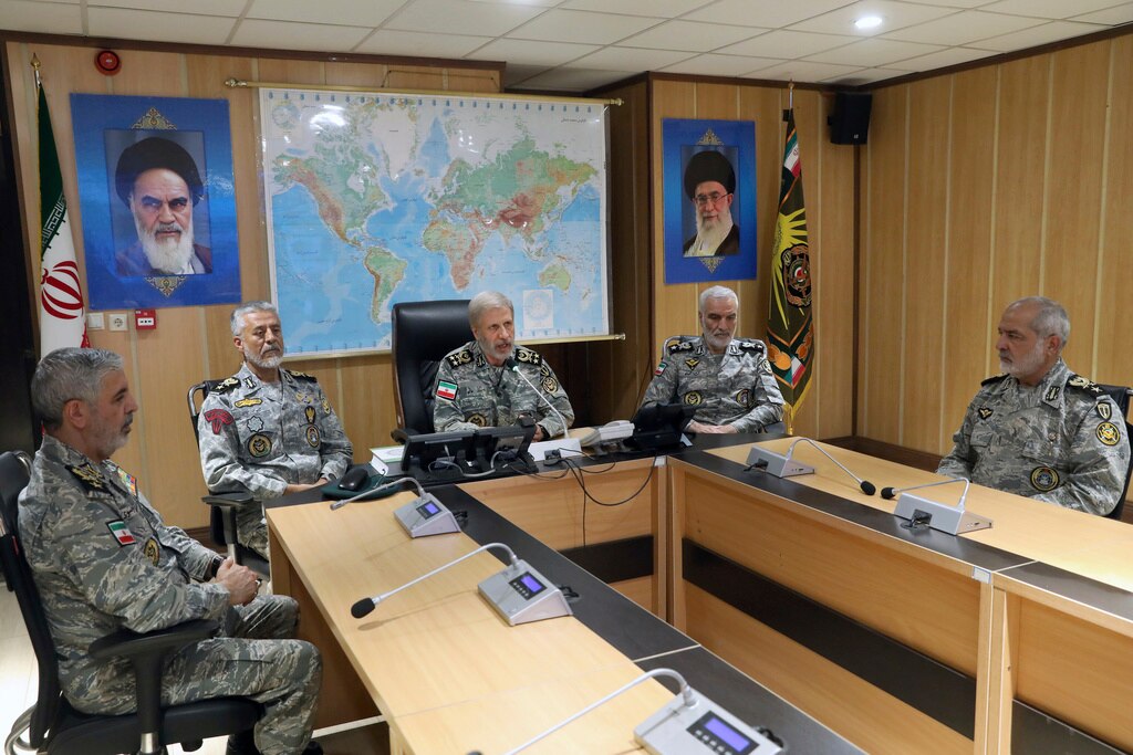 Iran's army commander-in-chief Gen. Amir Hatami, center, accompanied by high ranked army commanders, speaks in a video call with top commanders of the army, in Zolfaghar central headquarters, Iran.