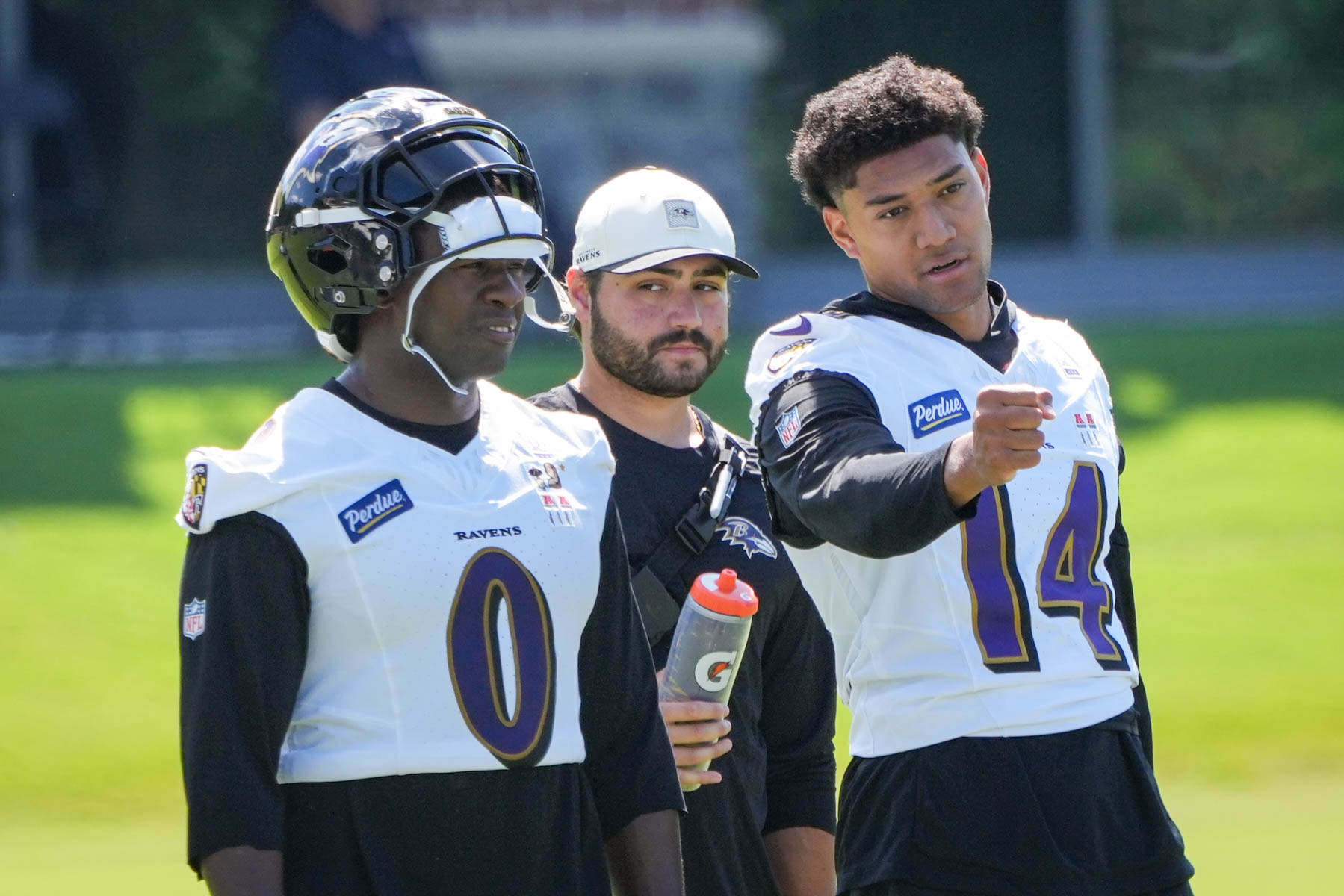 Linebacker Roquan Smith, left, talks to safety Kyle Hamilton during training camp Thursday in Owings Mills.
